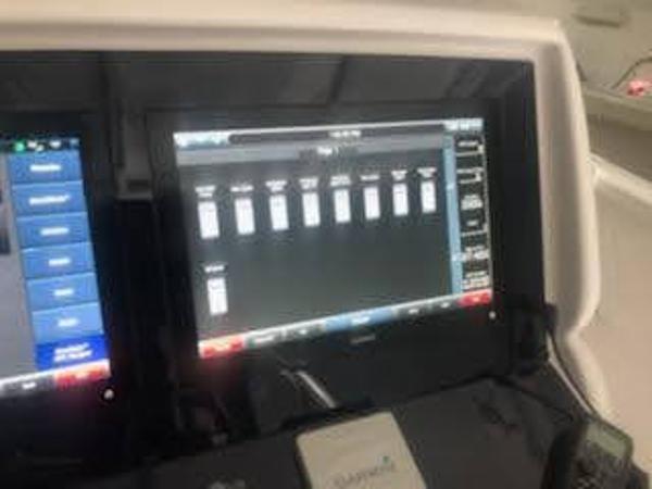 Dashboard of a 2019 Midnight Express 39 Cuddy boat with electronic display.
