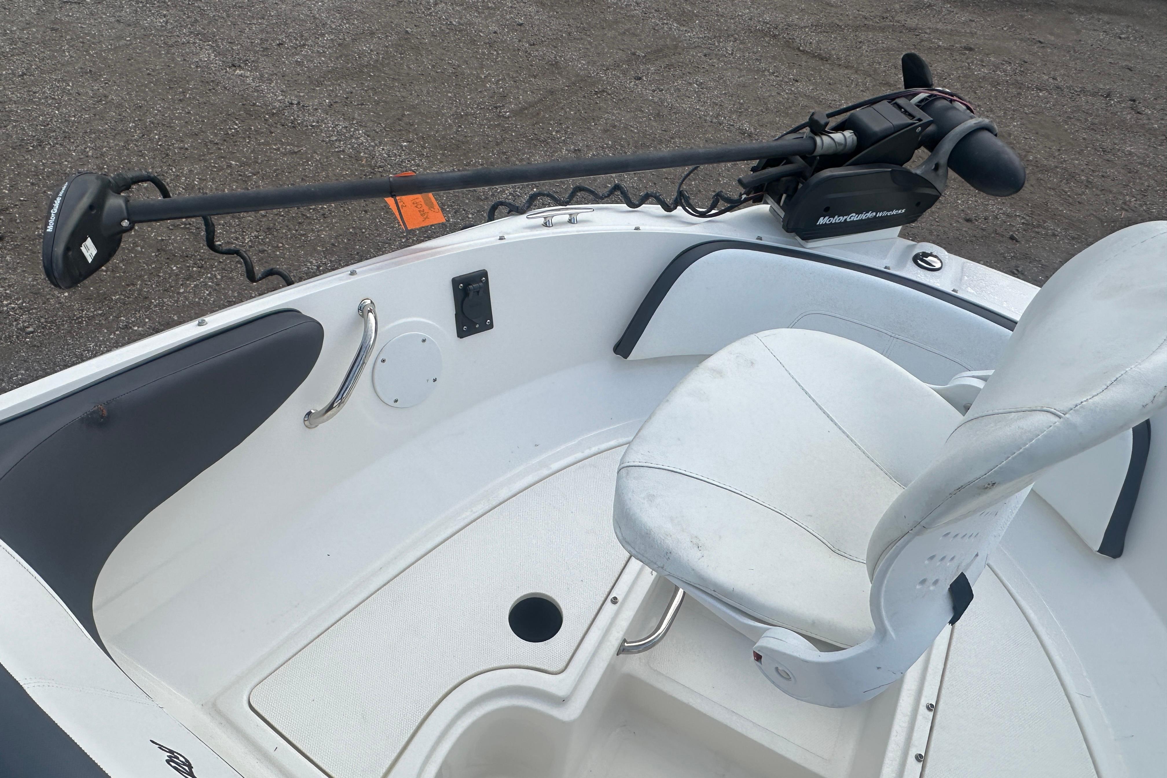 2017 Sea Ray SPX 190 Outboard boat interior with white seating and trolling motor.