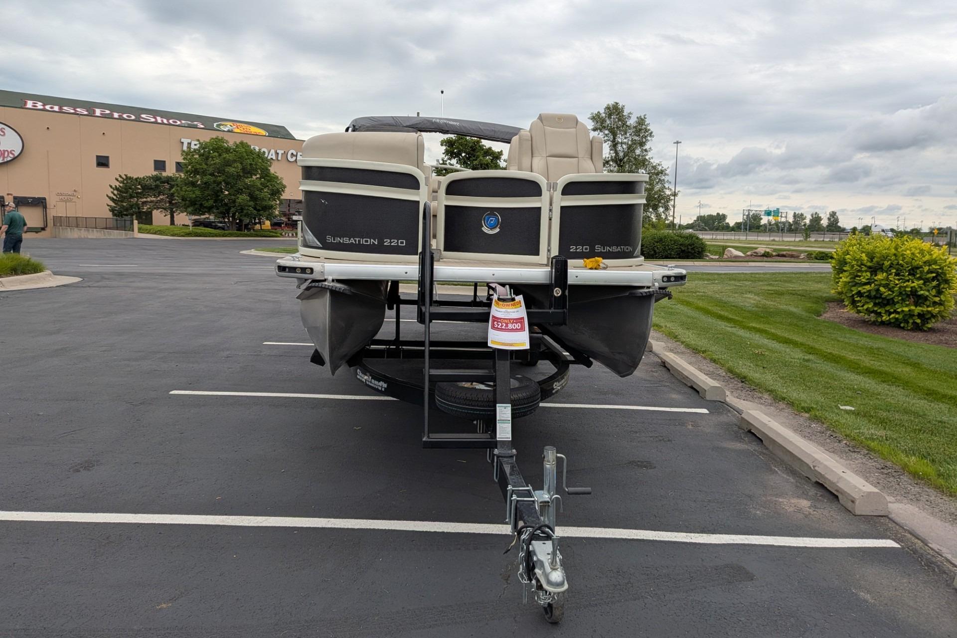 2018 Premier 220 SunSation pontoon boat parked at Bass Pro Shops.