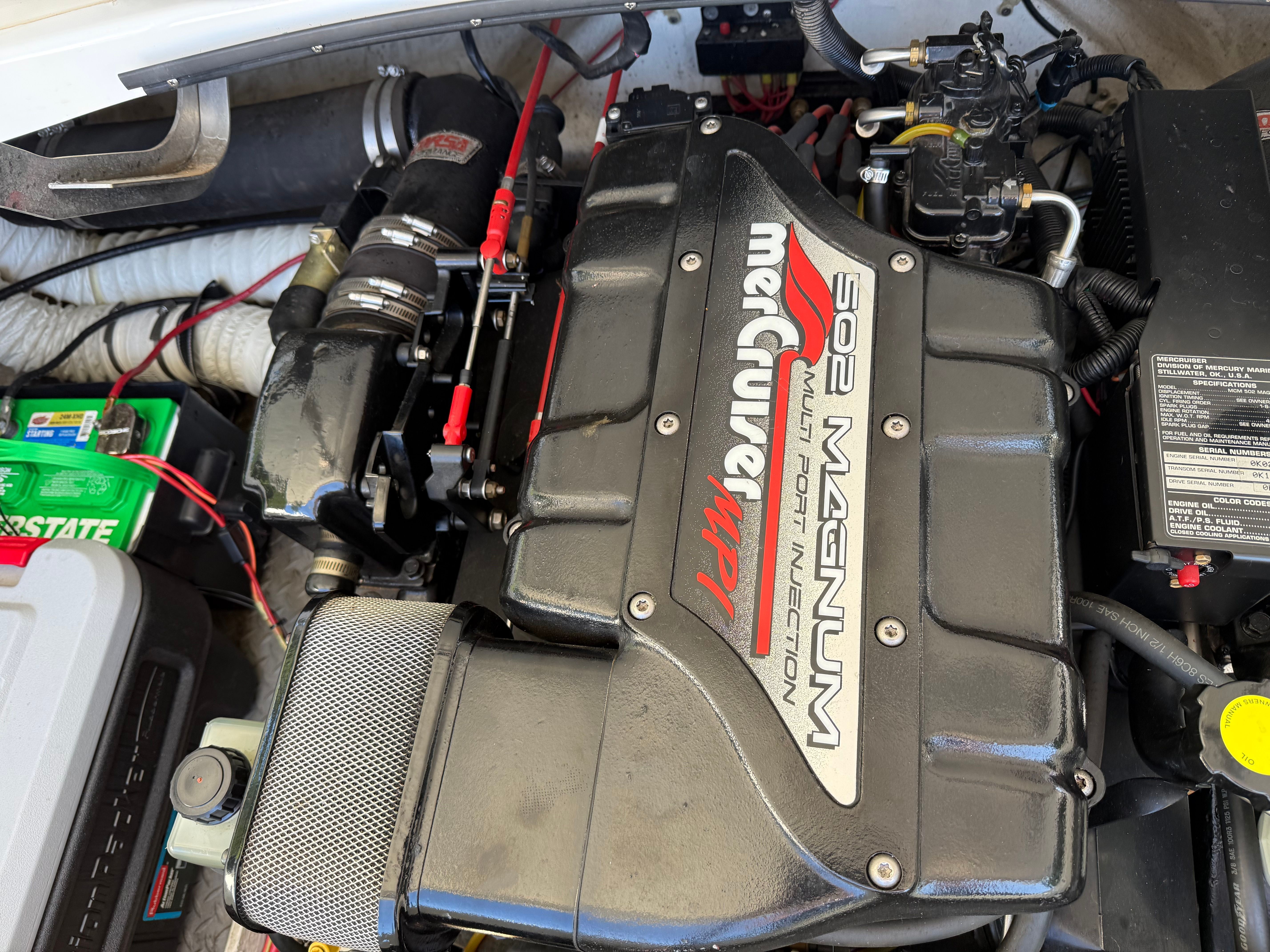 Engine compartment of an Arriva 2550 boat featuring a MerCruiser 502 Magnum engine.