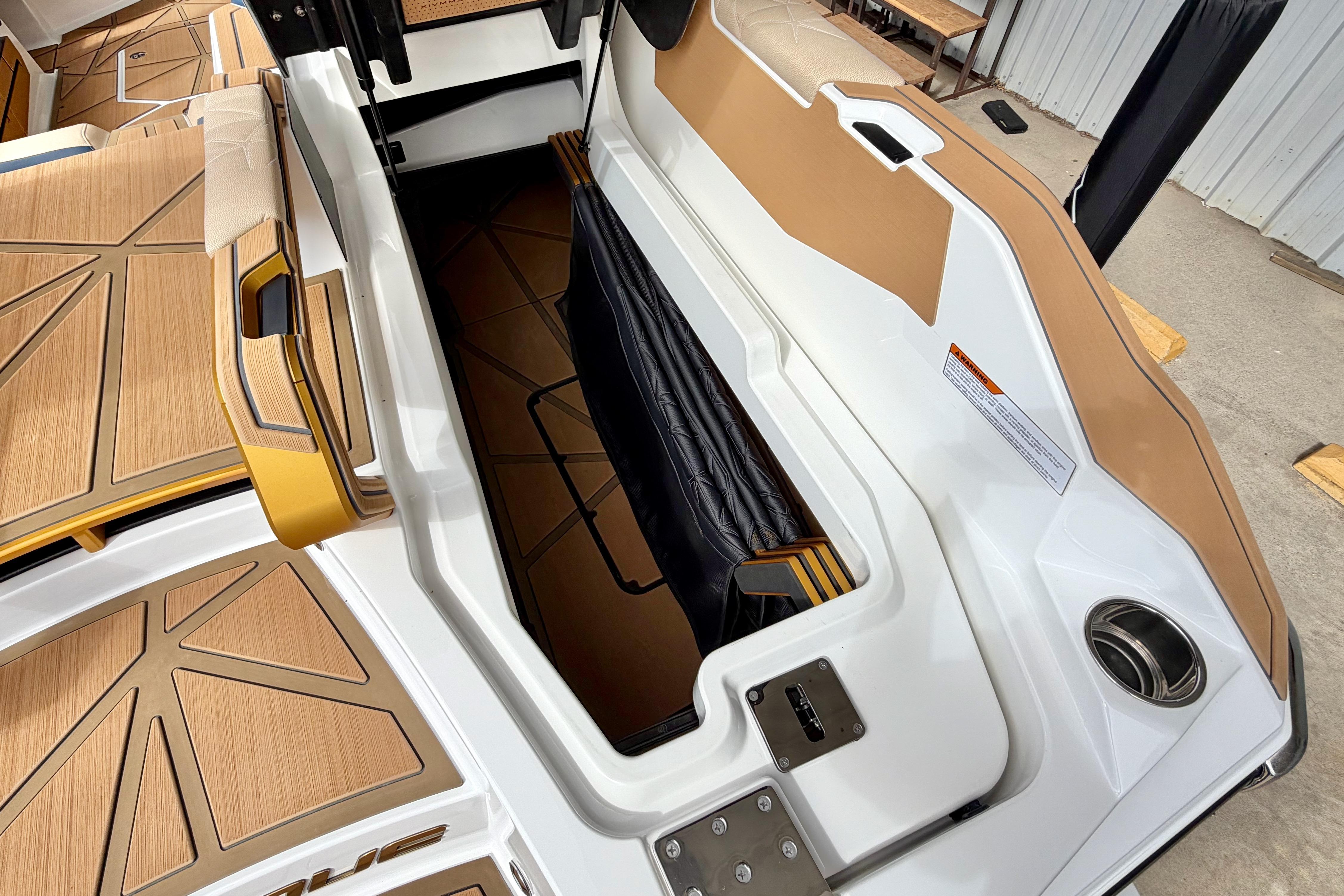 2025 Nautique Super Air Nautique G25 Paragon interior storage compartment with luxurious seating.