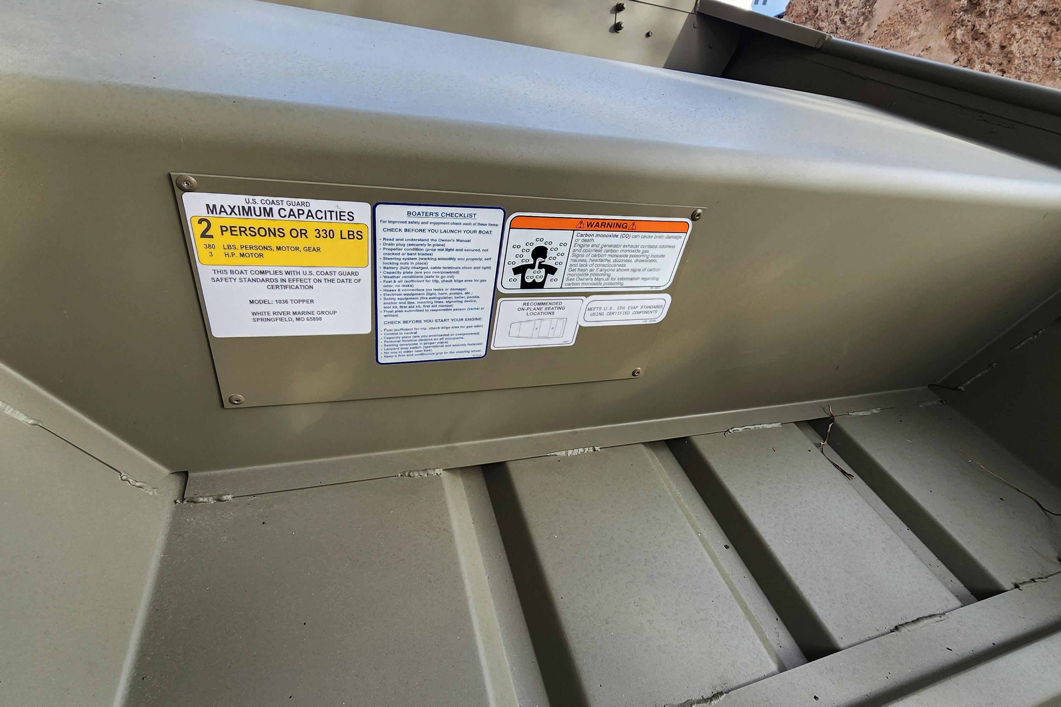 2026 Tracker Grizzly 10 Jon boat capacity and safety labels, maximum 2 persons or 330 lbs.