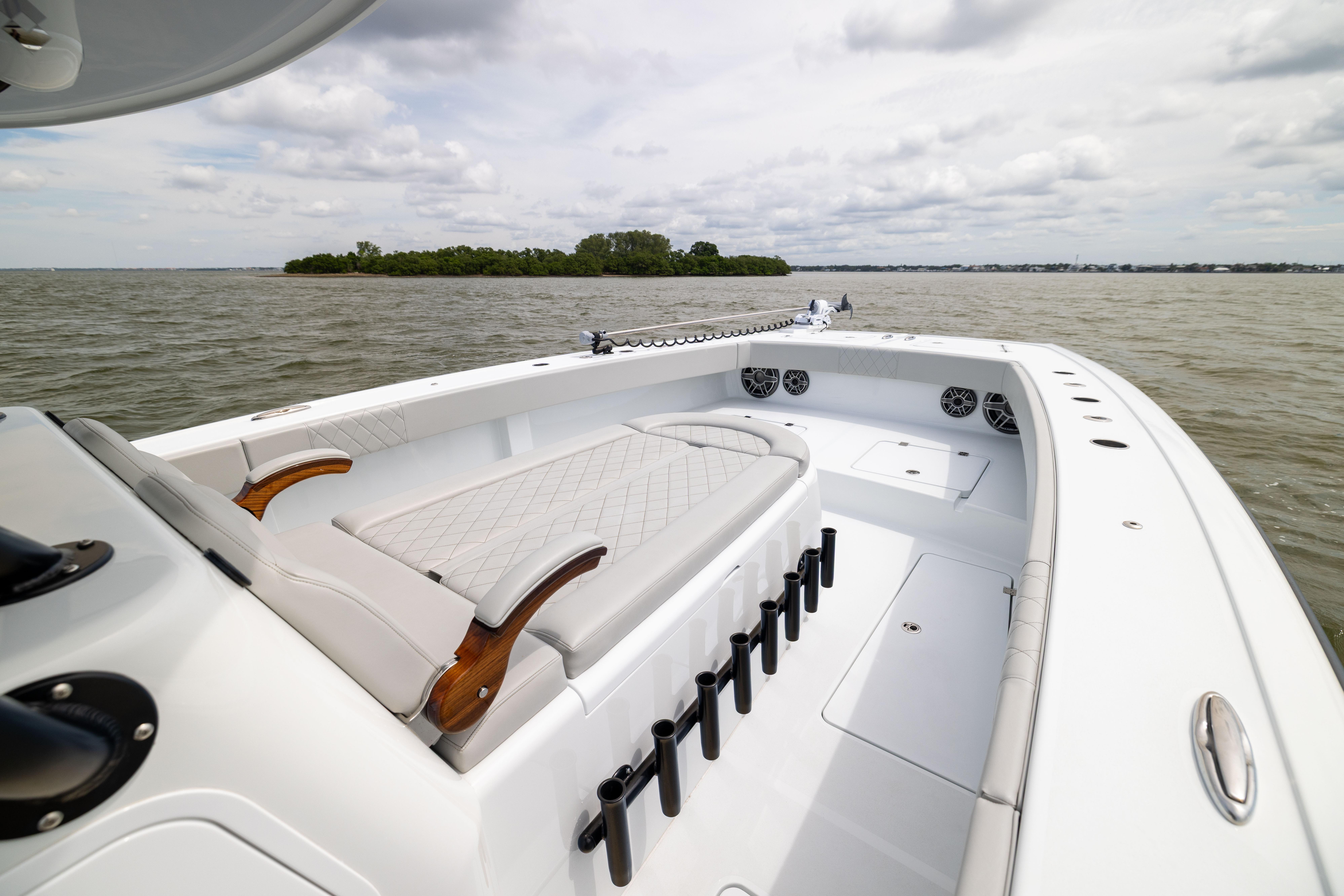 2025 Freeman 42 LR boat interior with seating, rod holders, and ocean view.