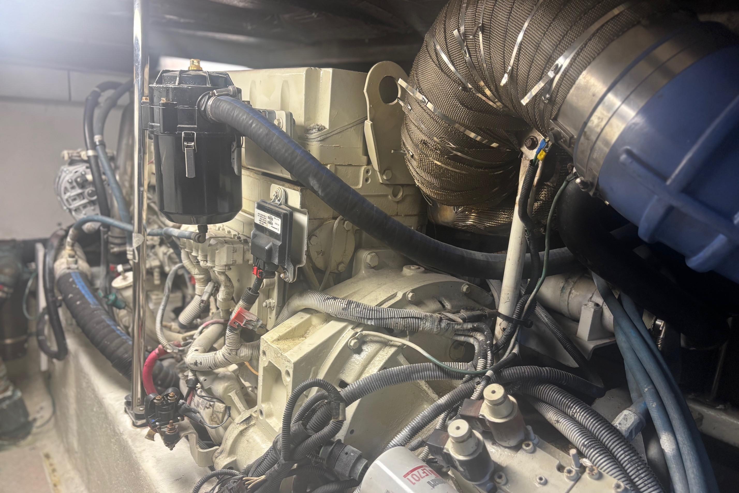 Engine room of a 2006 Sea Ray 52 Sedan Bridge yacht, showcasing complex machinery.