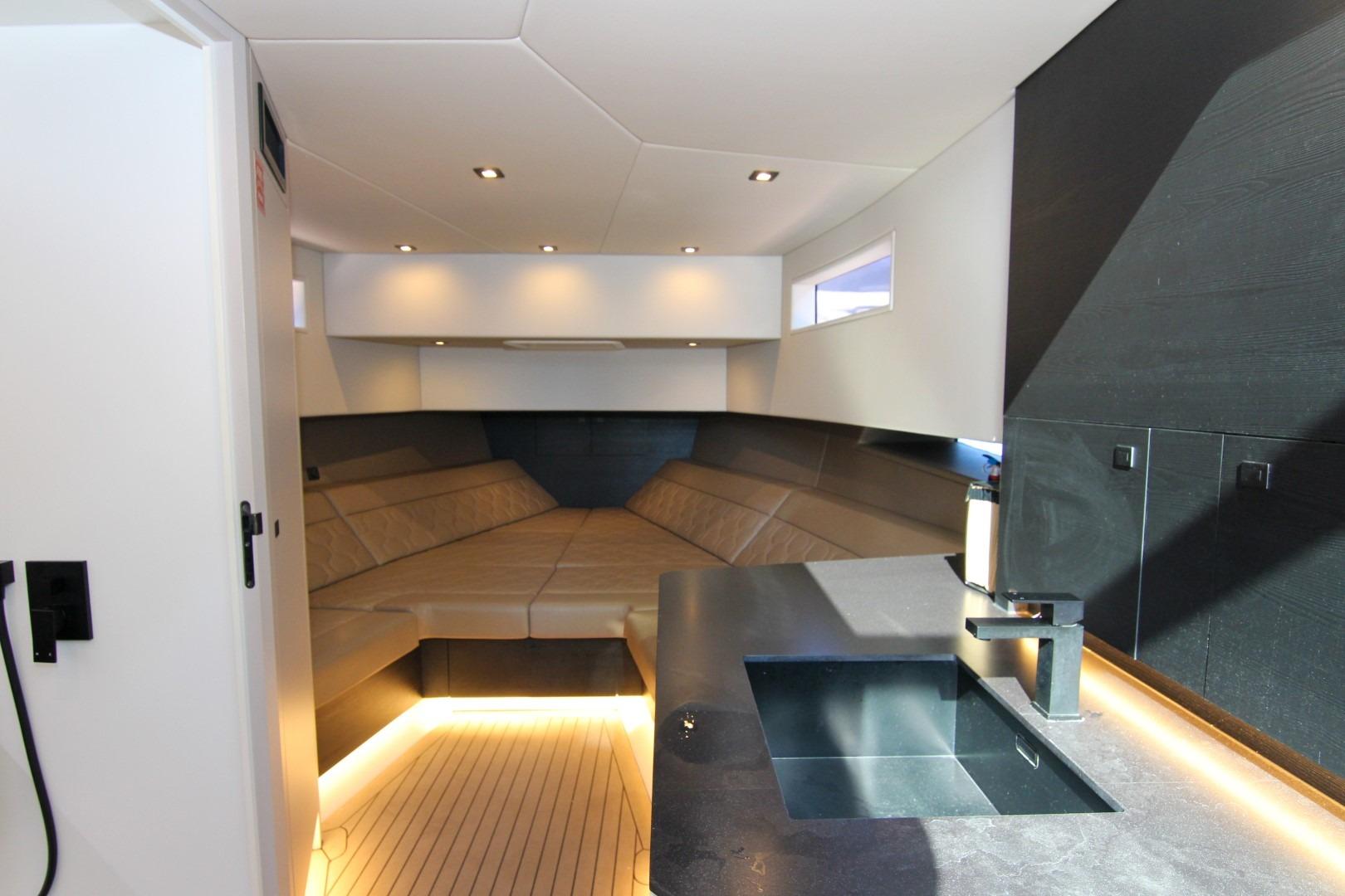 Luxurious interior of 2022 Vanquish Yachts VQ45 with modern seating and sleek design.