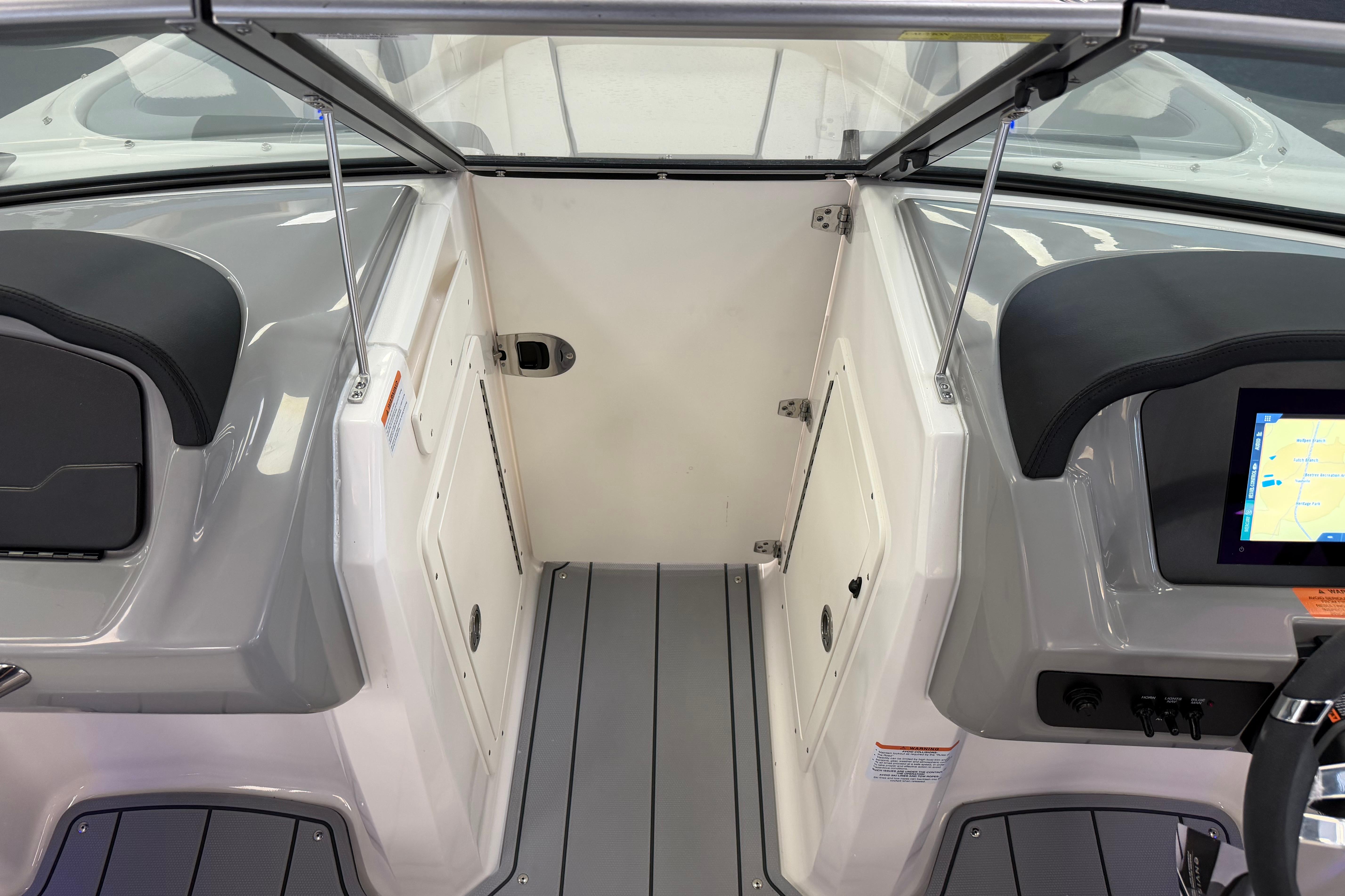 Interior view of 2025 Chaparral 21 SSi OB boat, featuring sleek dashboard and seating.