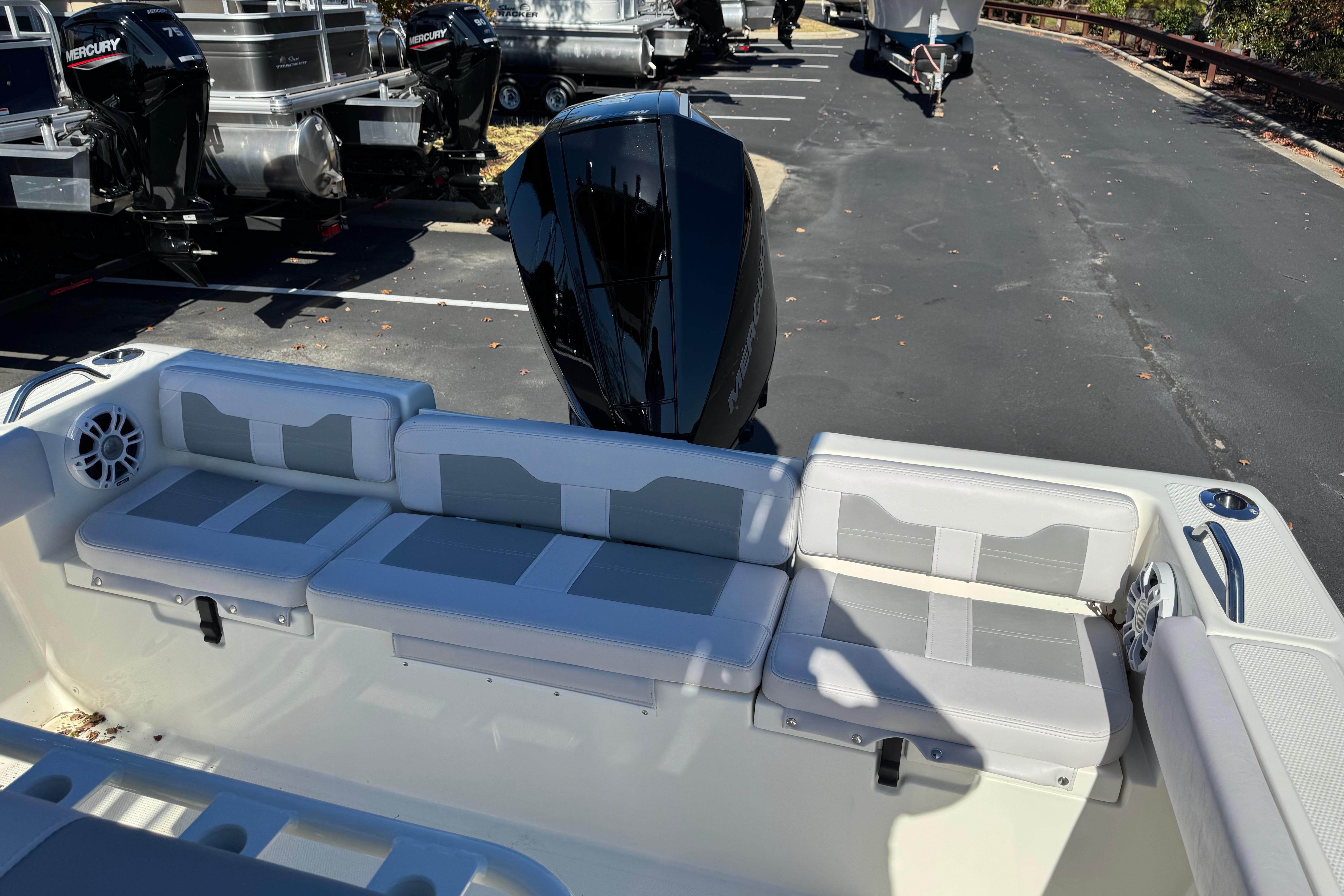 2026 Mako 214 Center Console boat with cushioned seating and powerful outboard motor.
