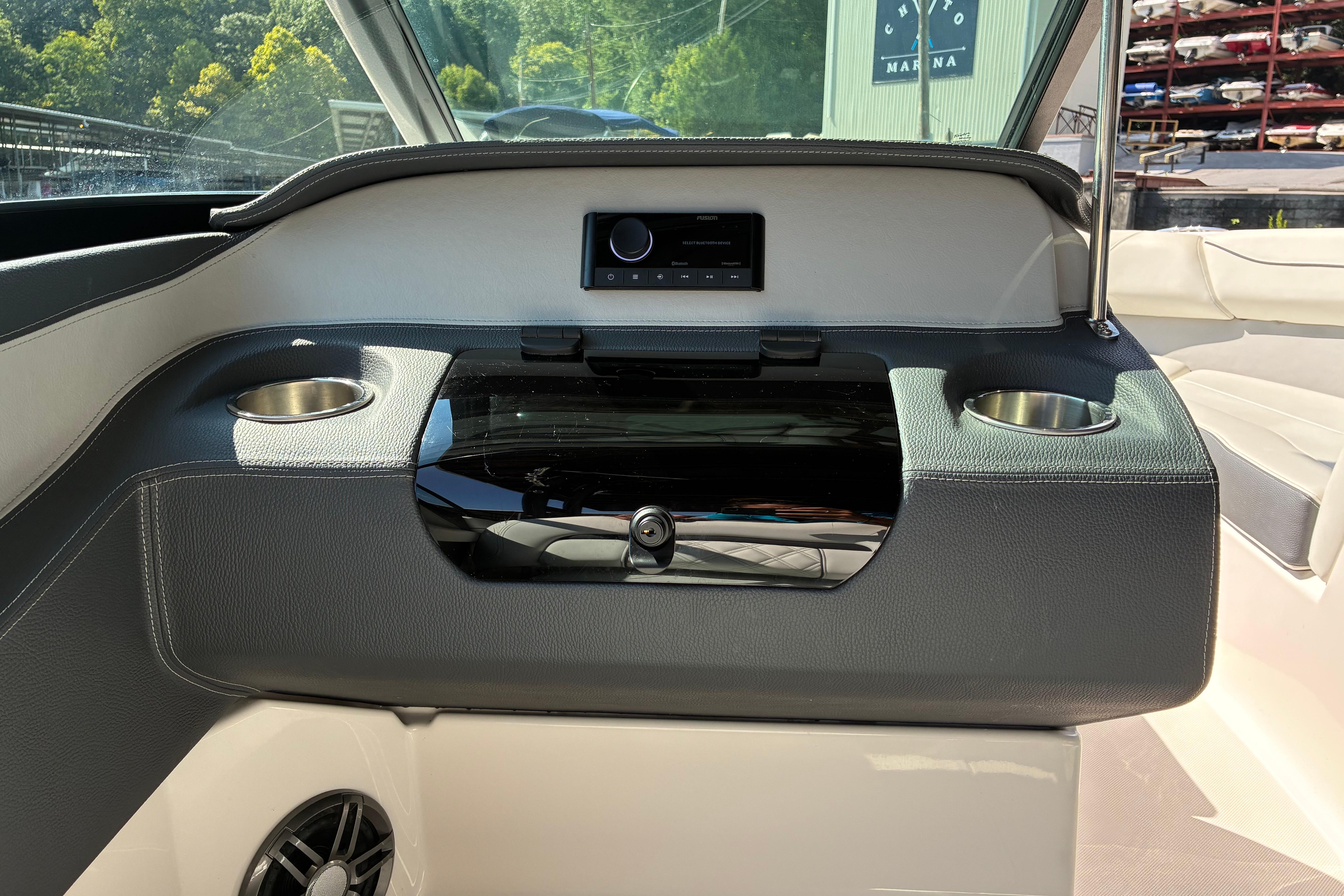 2025 Regal LS2 boat interior with cup holders and control panel.
