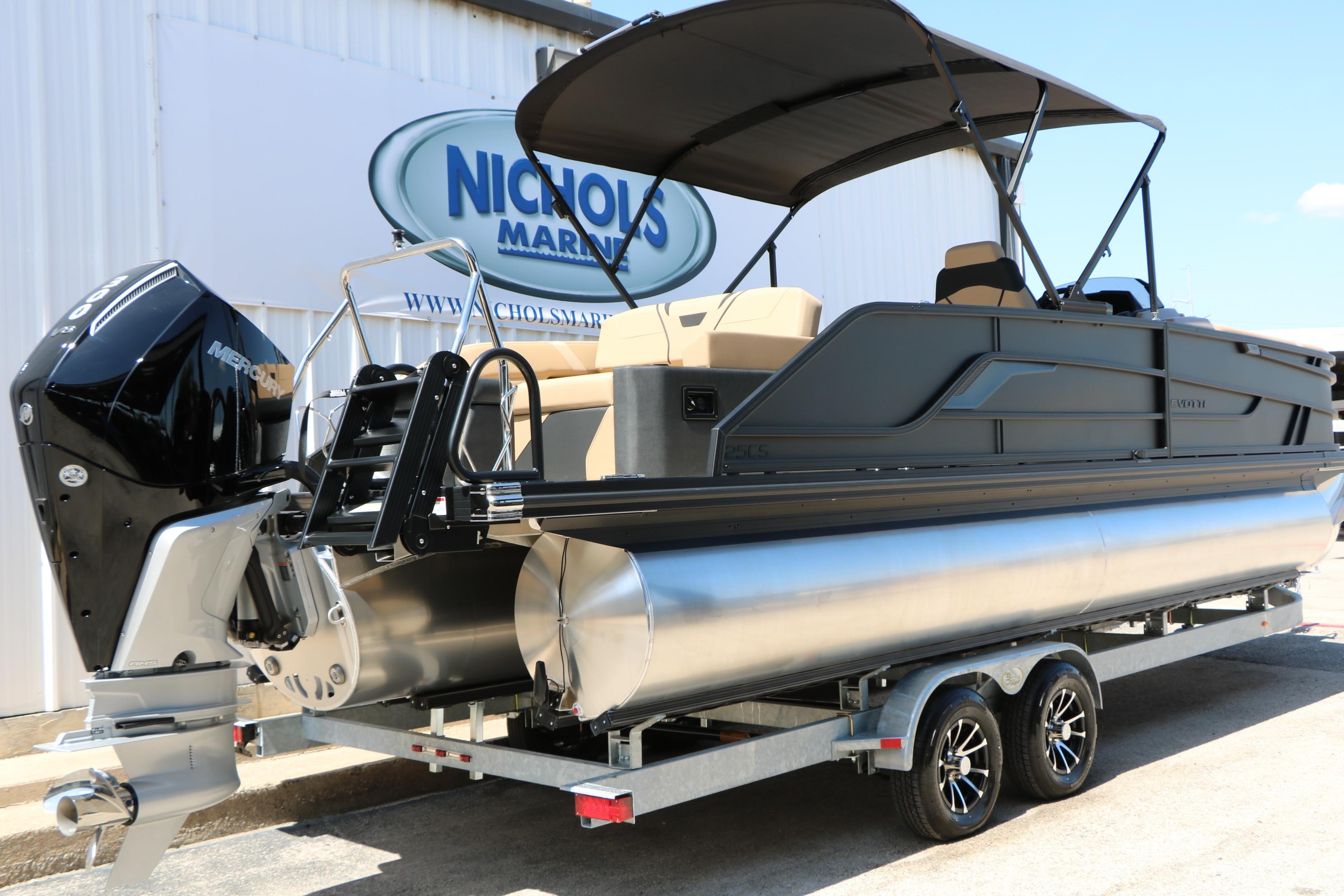 2026 Evotti 725 CS Tri-Toon boat on trailer at Nichols Marine dealership.