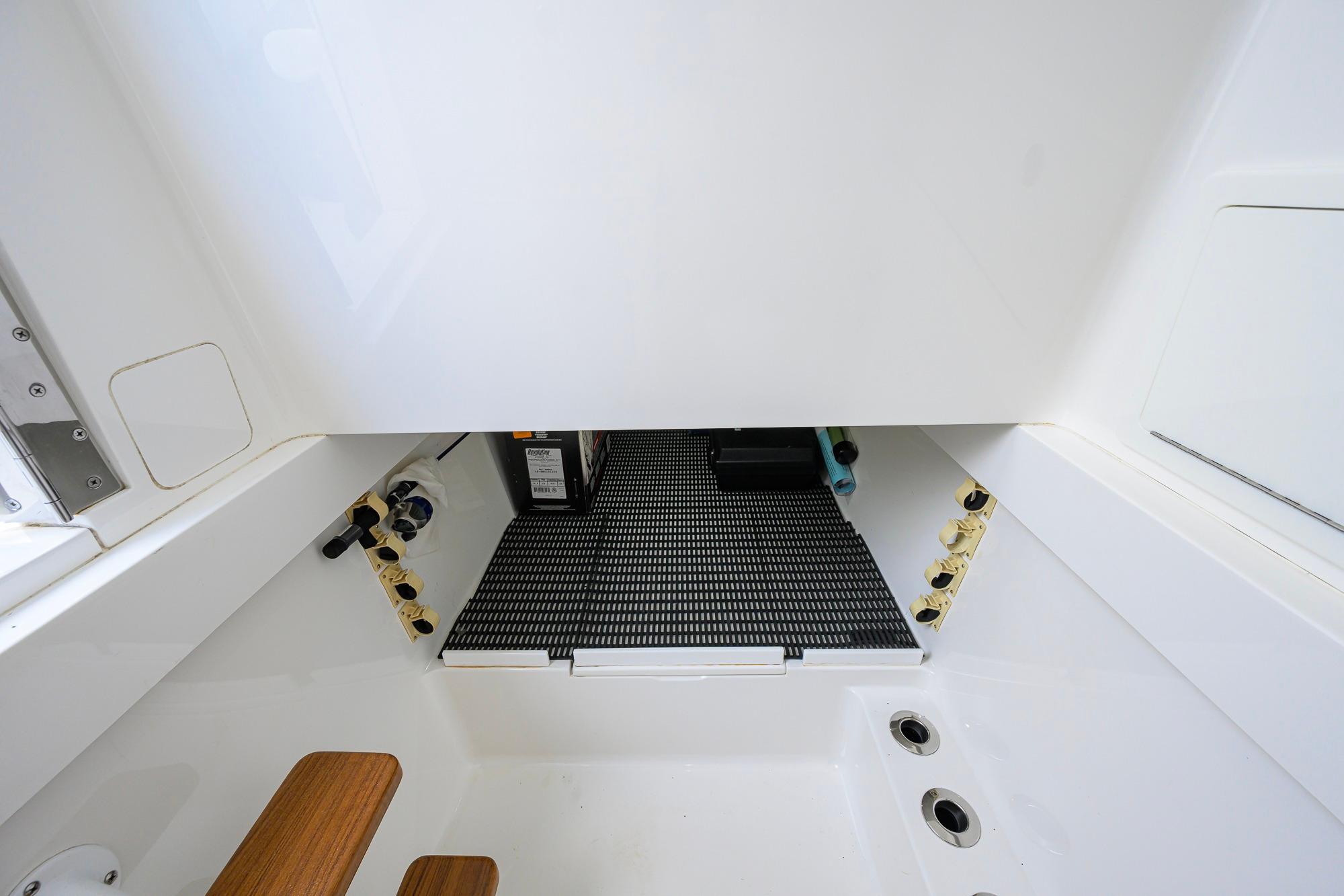 Interior view of 2020 Valhalla Boatworks V-41, showcasing storage compartment and fittings.