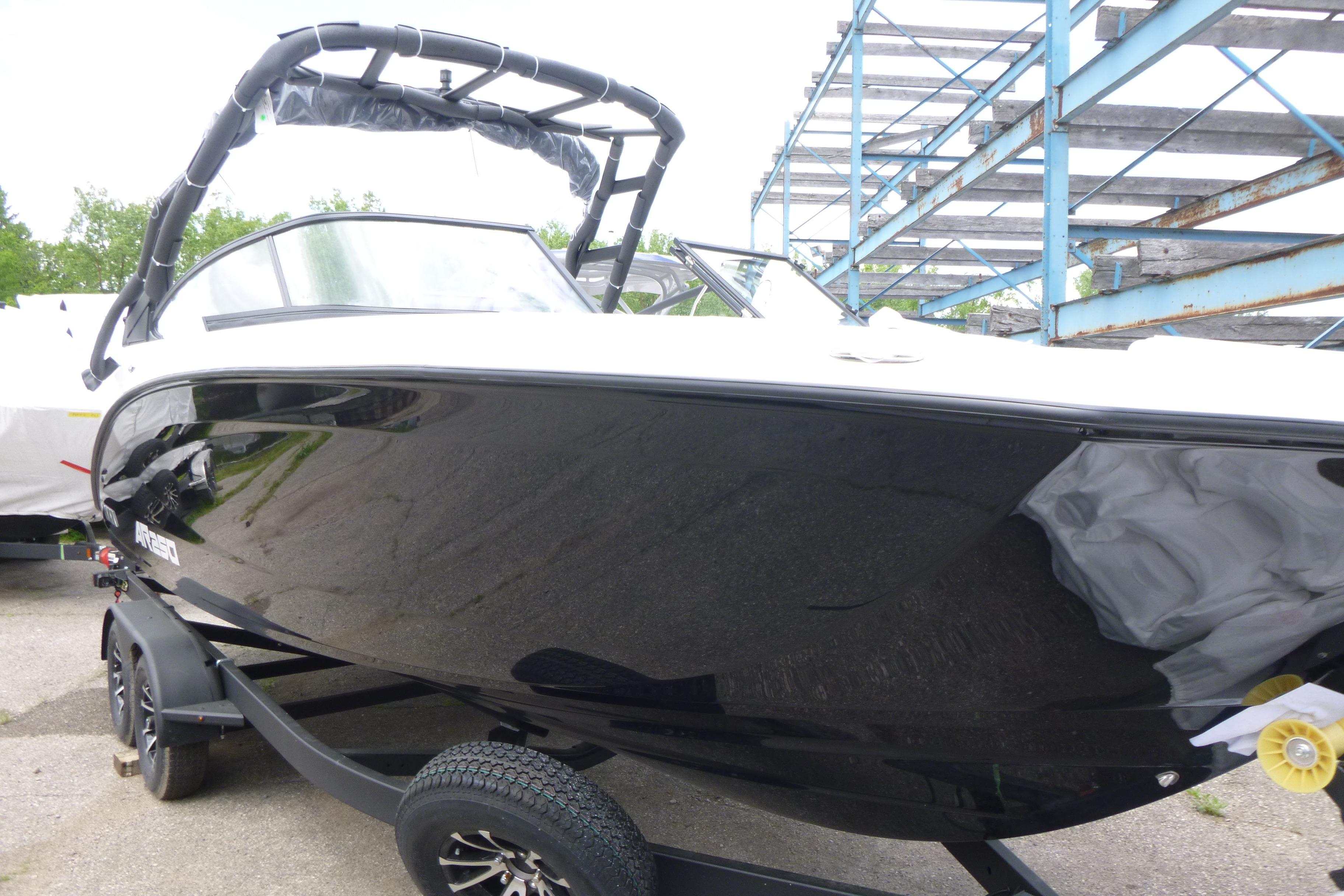 2026 Yamaha Boats AR250, sleek black design, on trailer, outdoor setting.
