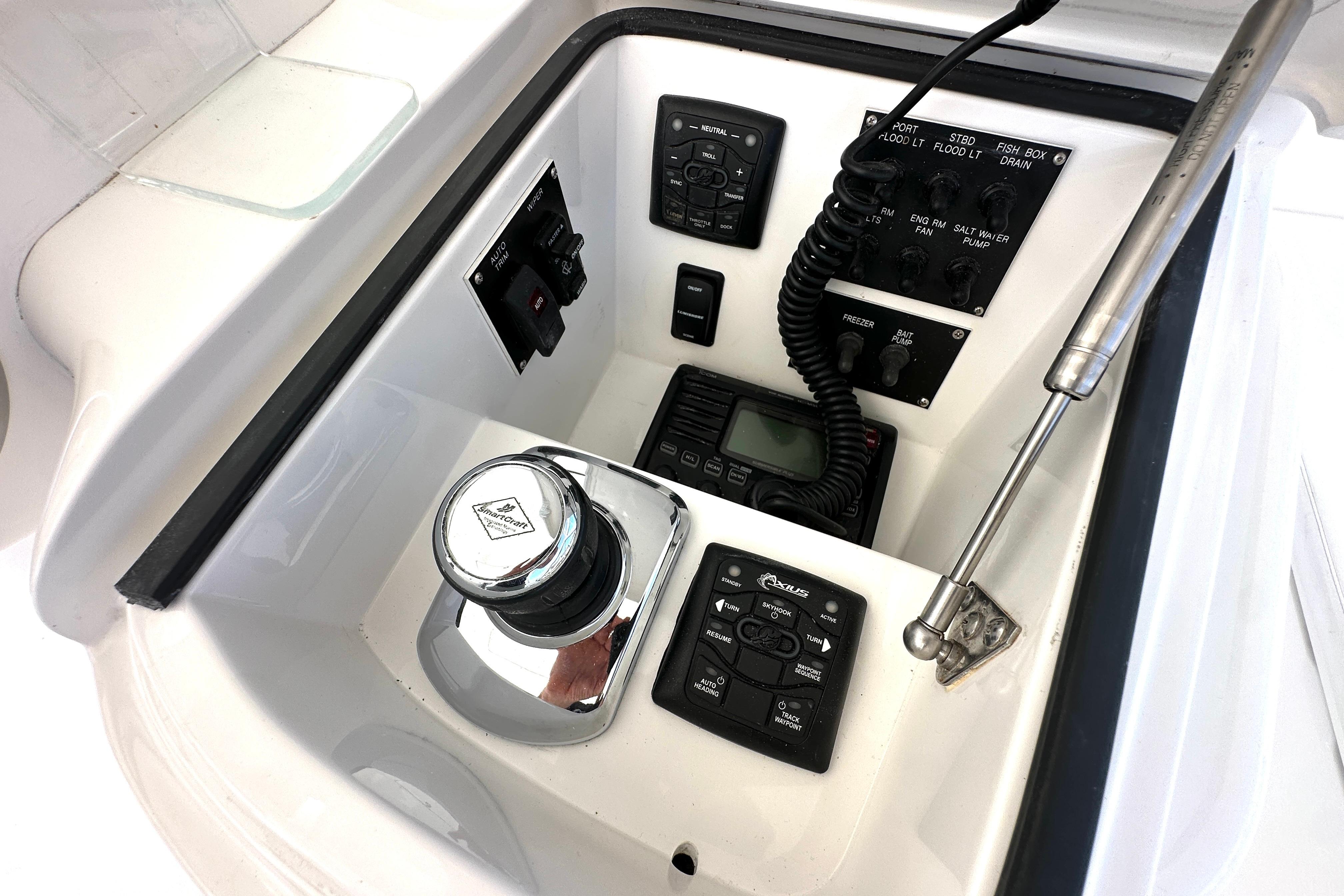 Control panel of a 2012 Viking 42 Open boat with various switches and devices.