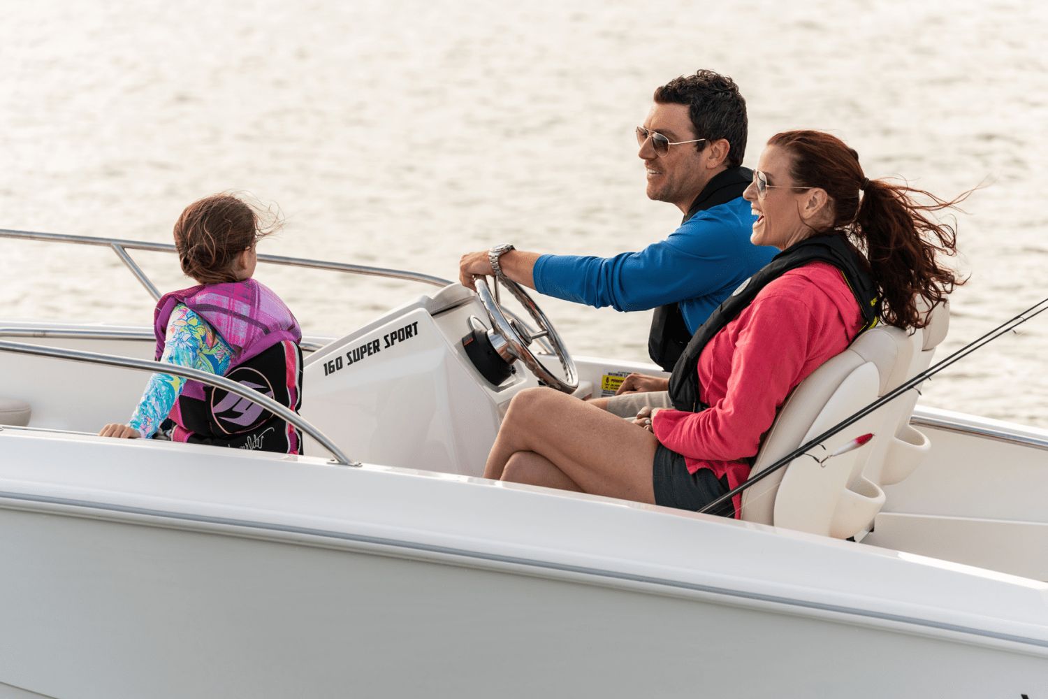 A family enjoys a boat ride on a Boston Whaler 160 Super Sport.