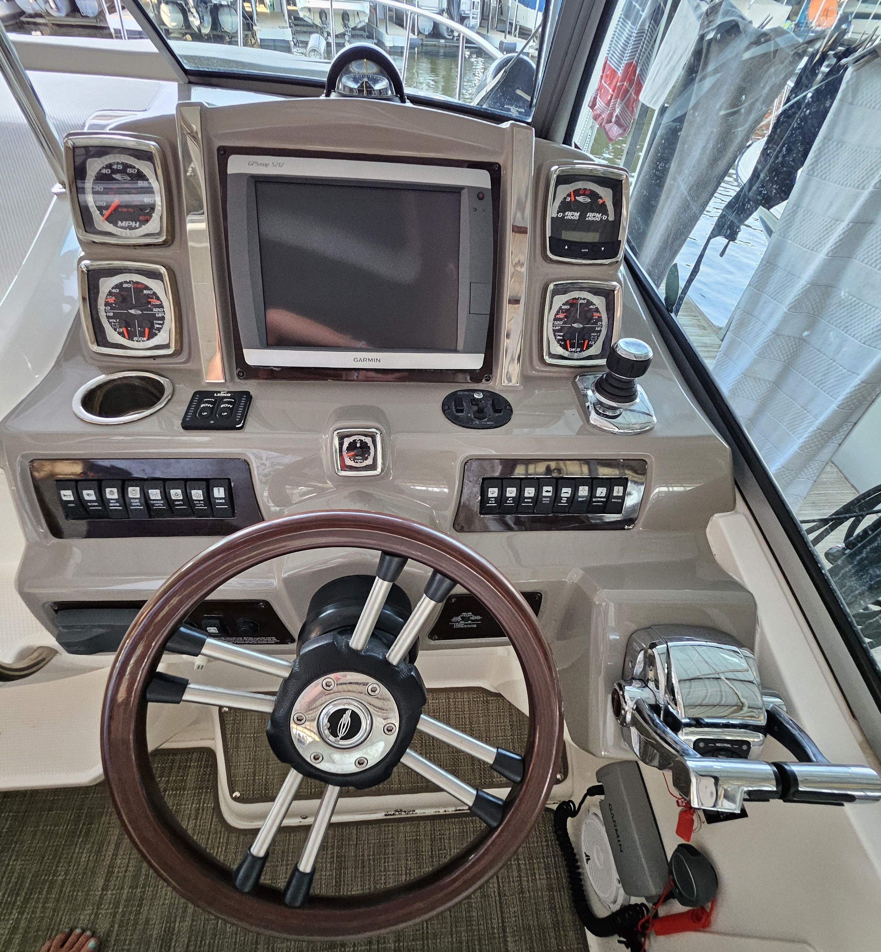 2014 Chaparral 330 Signature boat helm with instruments and controls.