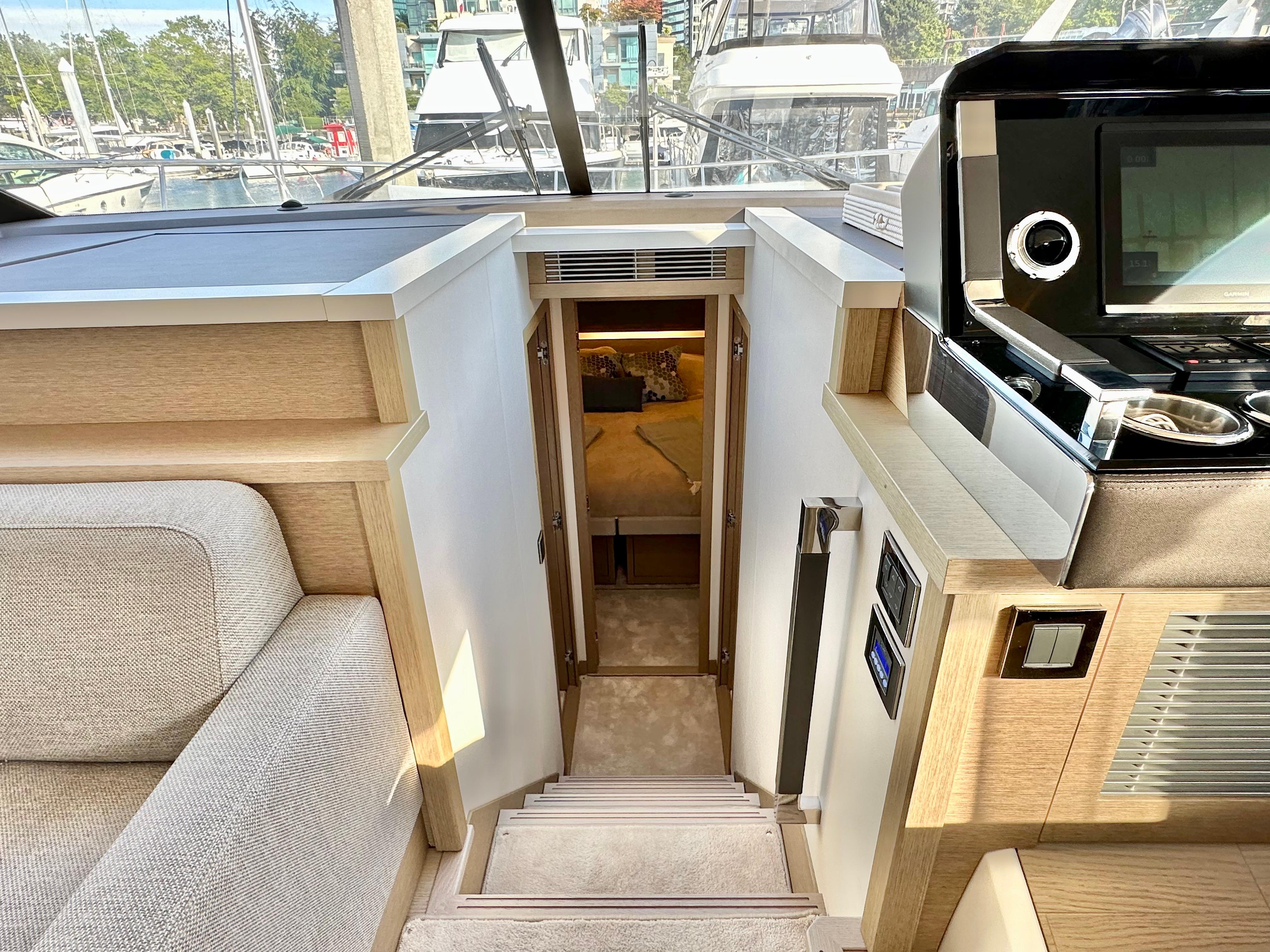 Luxurious interior of 2023 Prestige 520 yacht with modern design and comfortable seating.