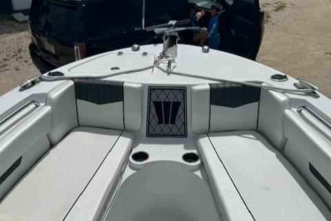 2022 Wellcraft 222 Fisherman boat interior with seating and cup holders.