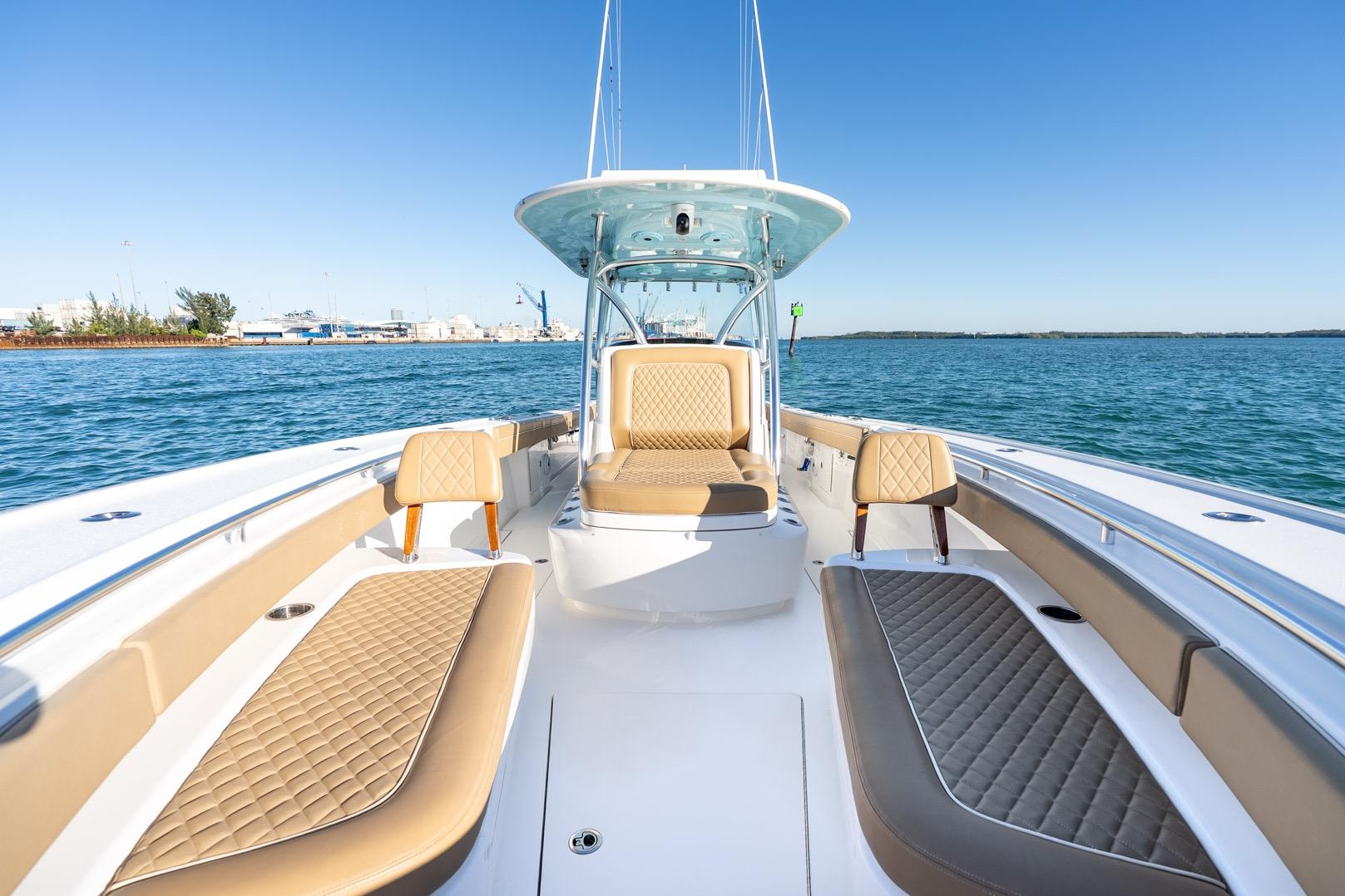 2022 Valhalla Boatworks V-37, luxurious seating, open water, clear sky, modern design.