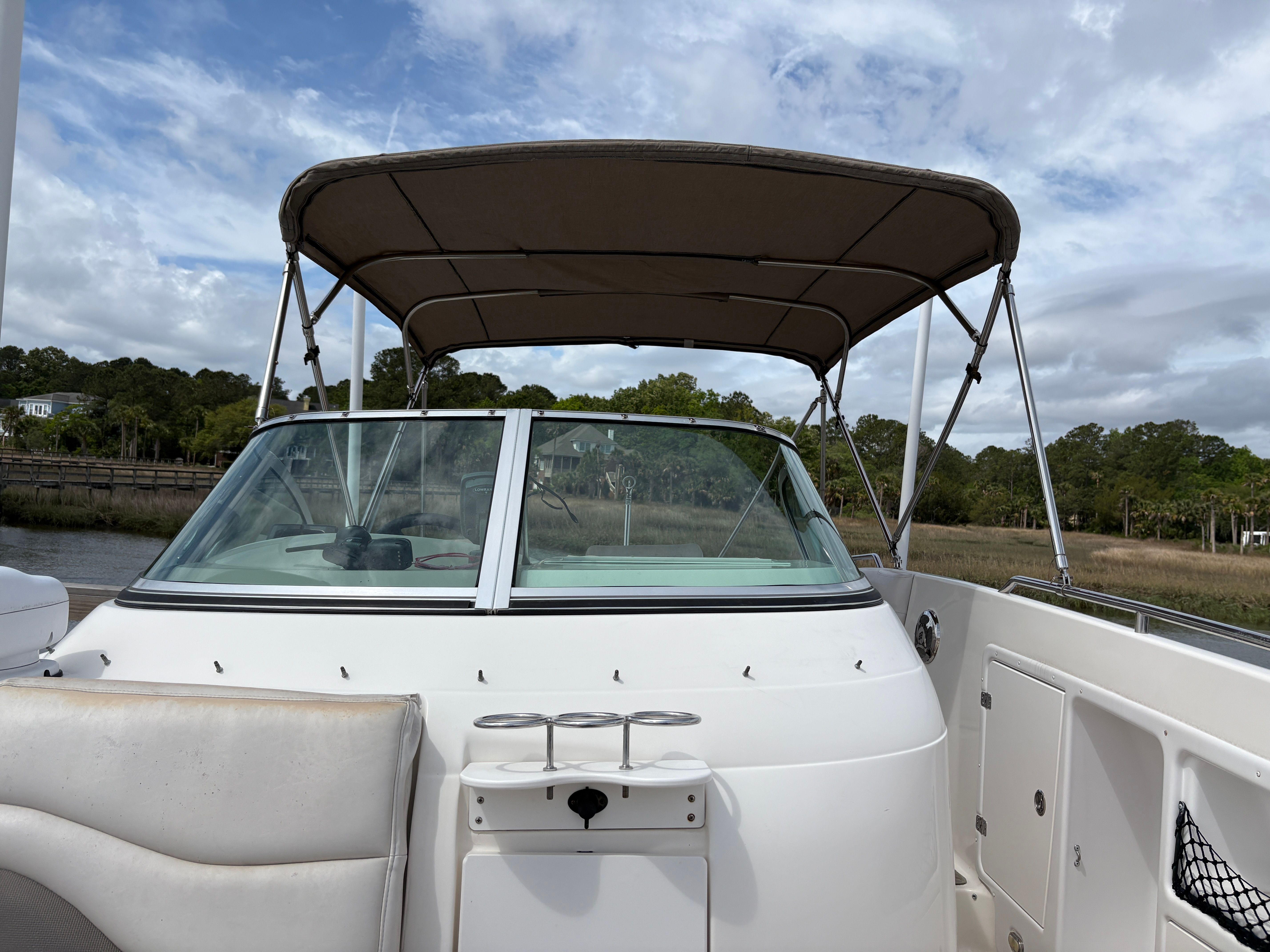 2009 Hurricane SUN DECK 260 boat with canopy and cockpit view.