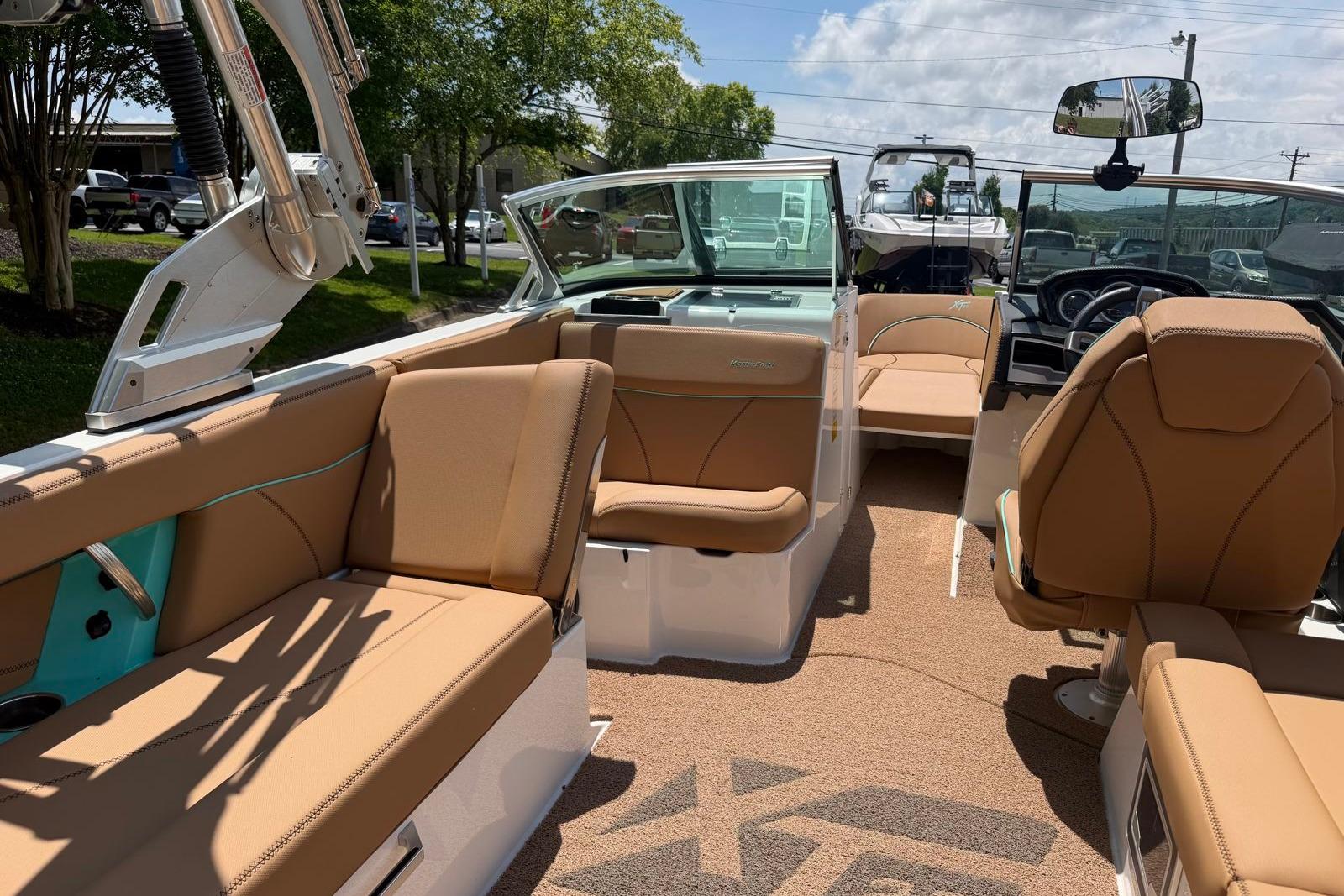 Interior of 2020 MasterCraft XT25 boat with tan seating and modern design.