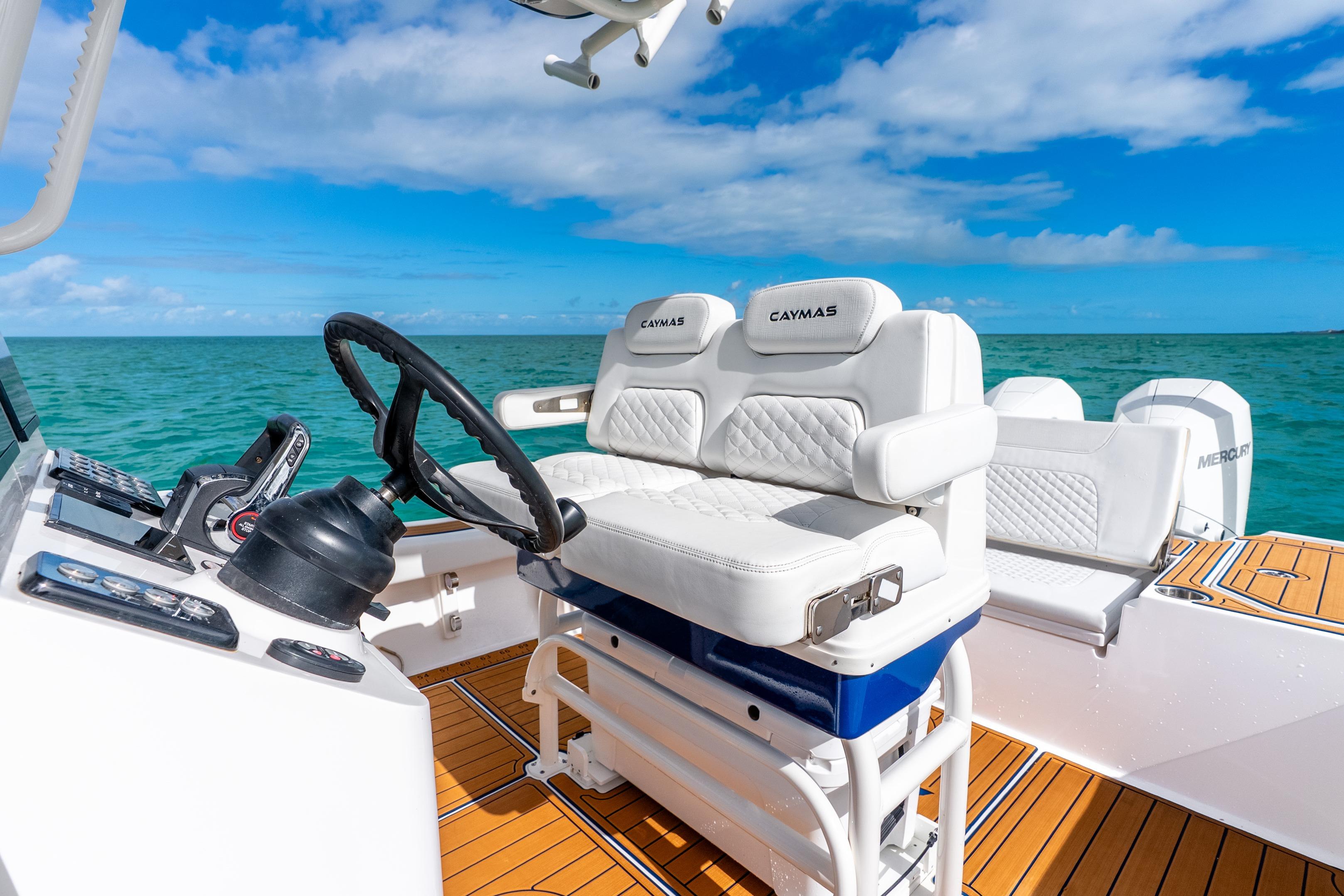 2024 Caymas 281 HB boat interior with white seating and ocean view.