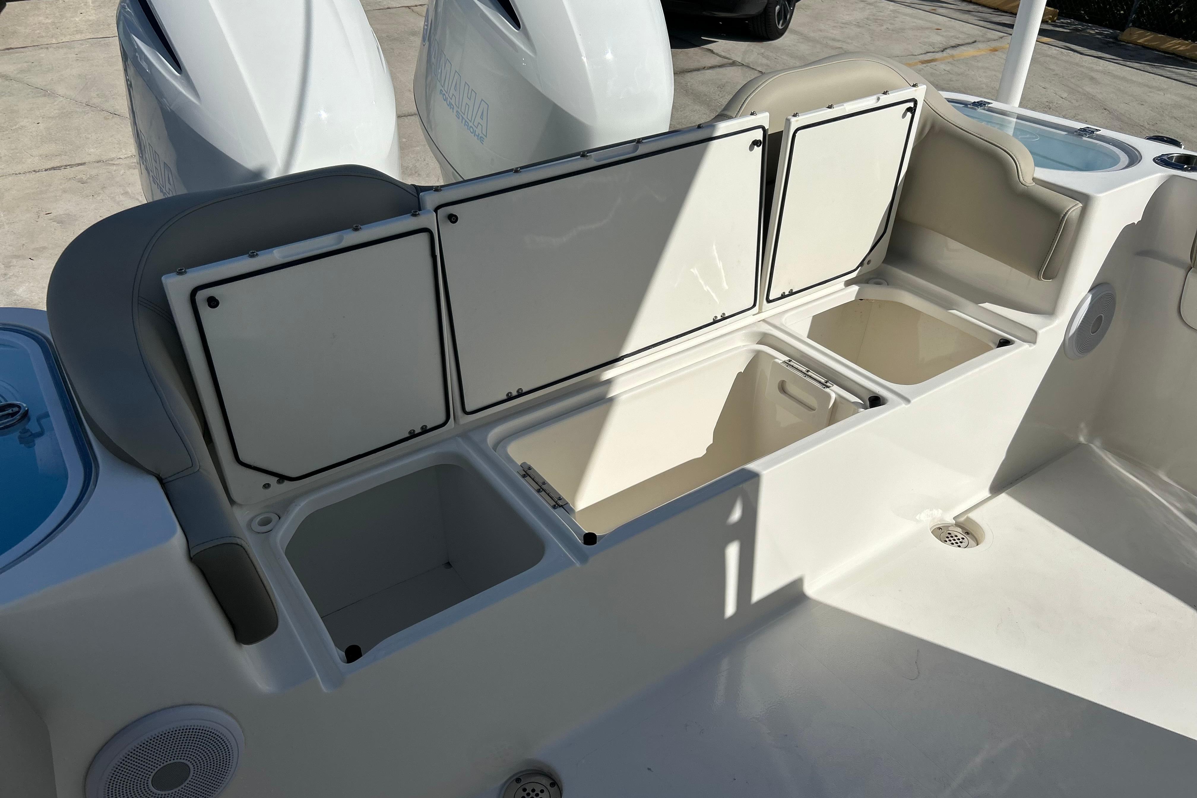 2023 Key West 263 FS boat storage compartments and seating area.