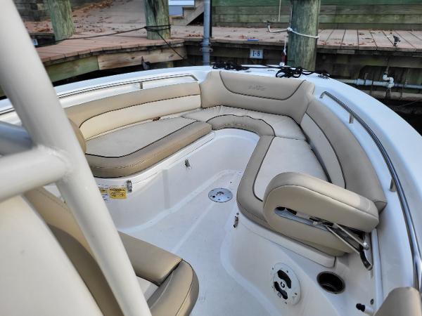 2021 NauticStar 2302 Legacy boat with beige cushioned seating in the bow area.