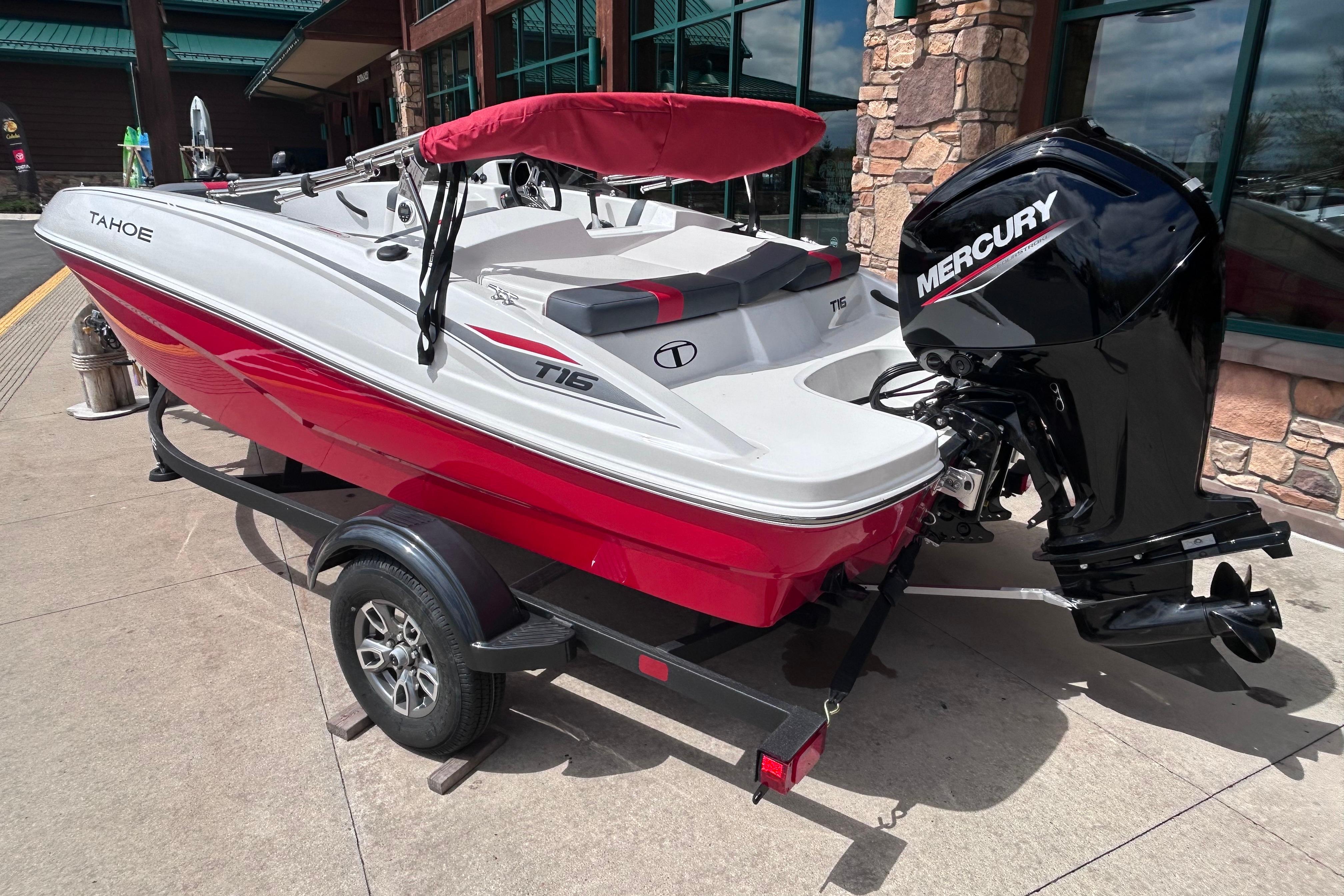 2026 Tahoe T16 boat with Mercury engine, red and white design, on a trailer.