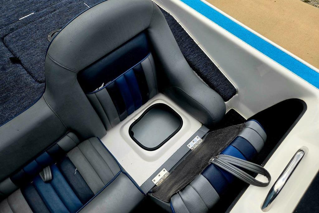 Interior of a 1996 Champion 181 SX boat with blue and gray seating.