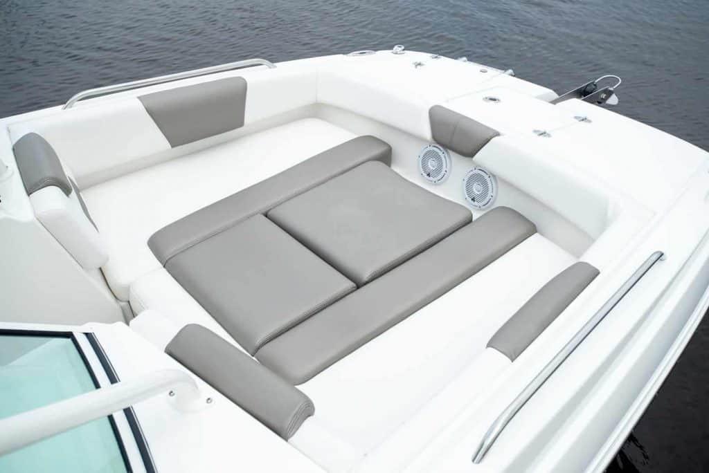 Manufacturer Provided Image: Luxurious seating area on 2026 World Cat 230 SD boat, featuring gray and white cushions.