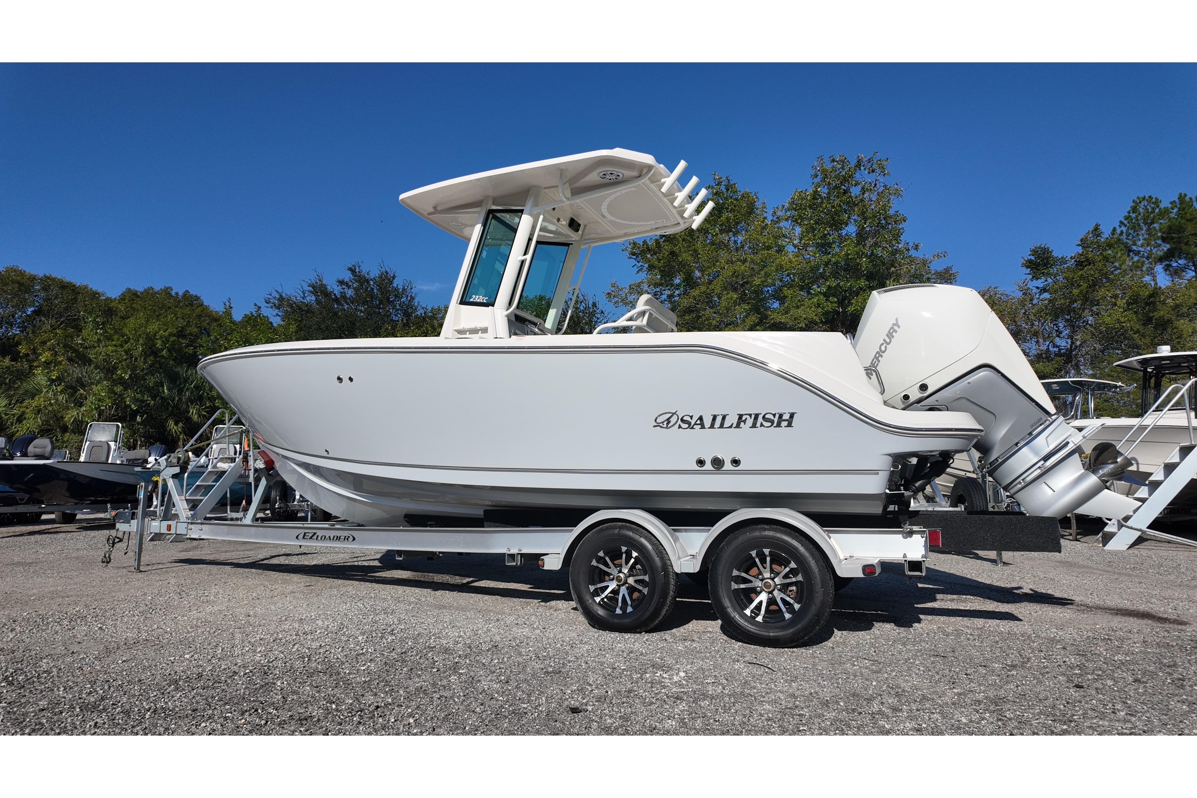 2026 Sailfish 232 CC boat on trailer, side view, outdoors, clear sky background.