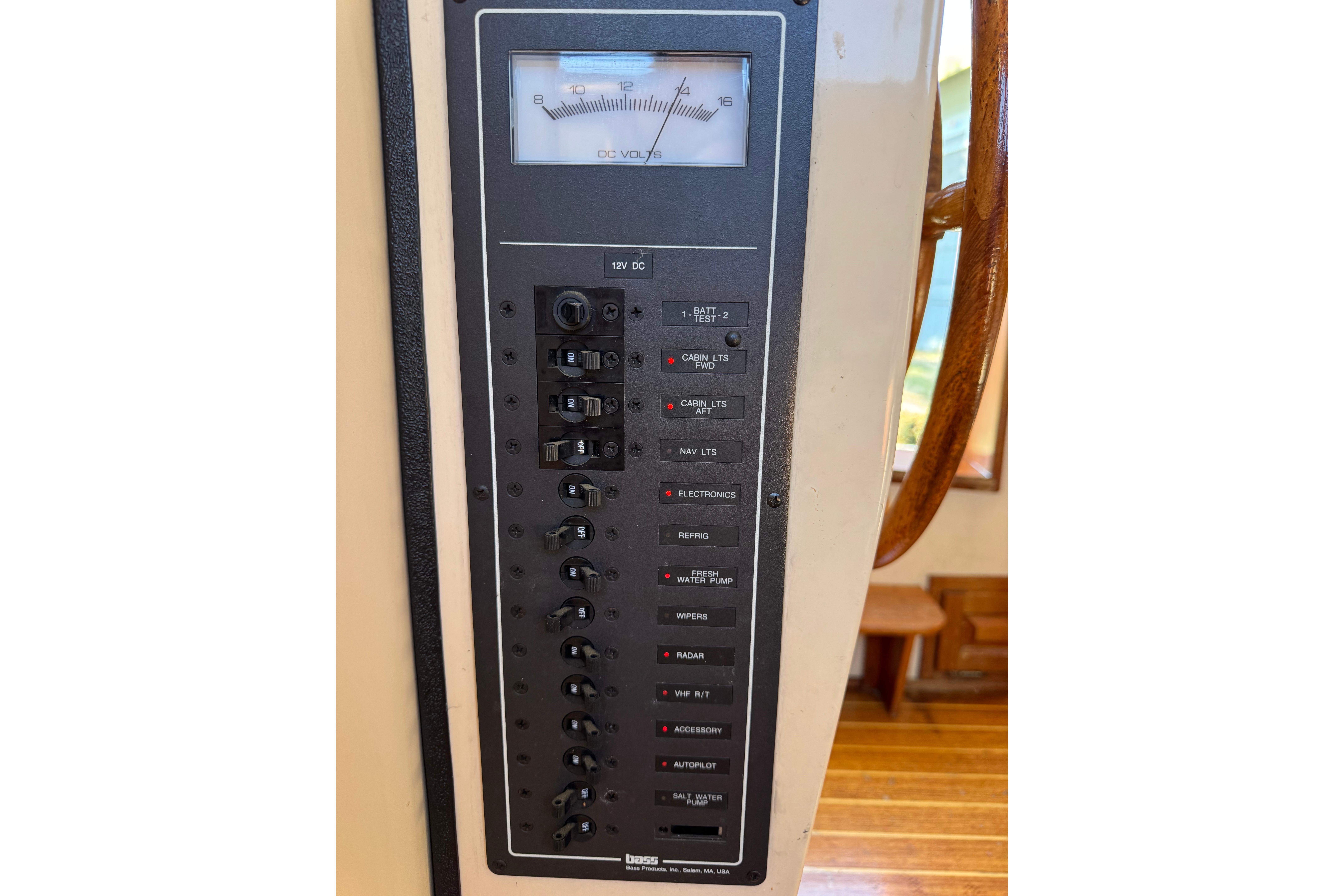 Electrical panel on a 1996 Nordic Tug 32 boat, featuring various switches and a voltmeter.