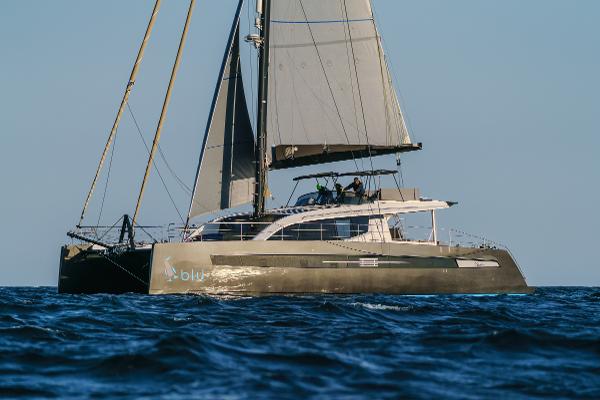 Luxury Privilege Signature 650 catamaran sailing on open sea, 2025 model.