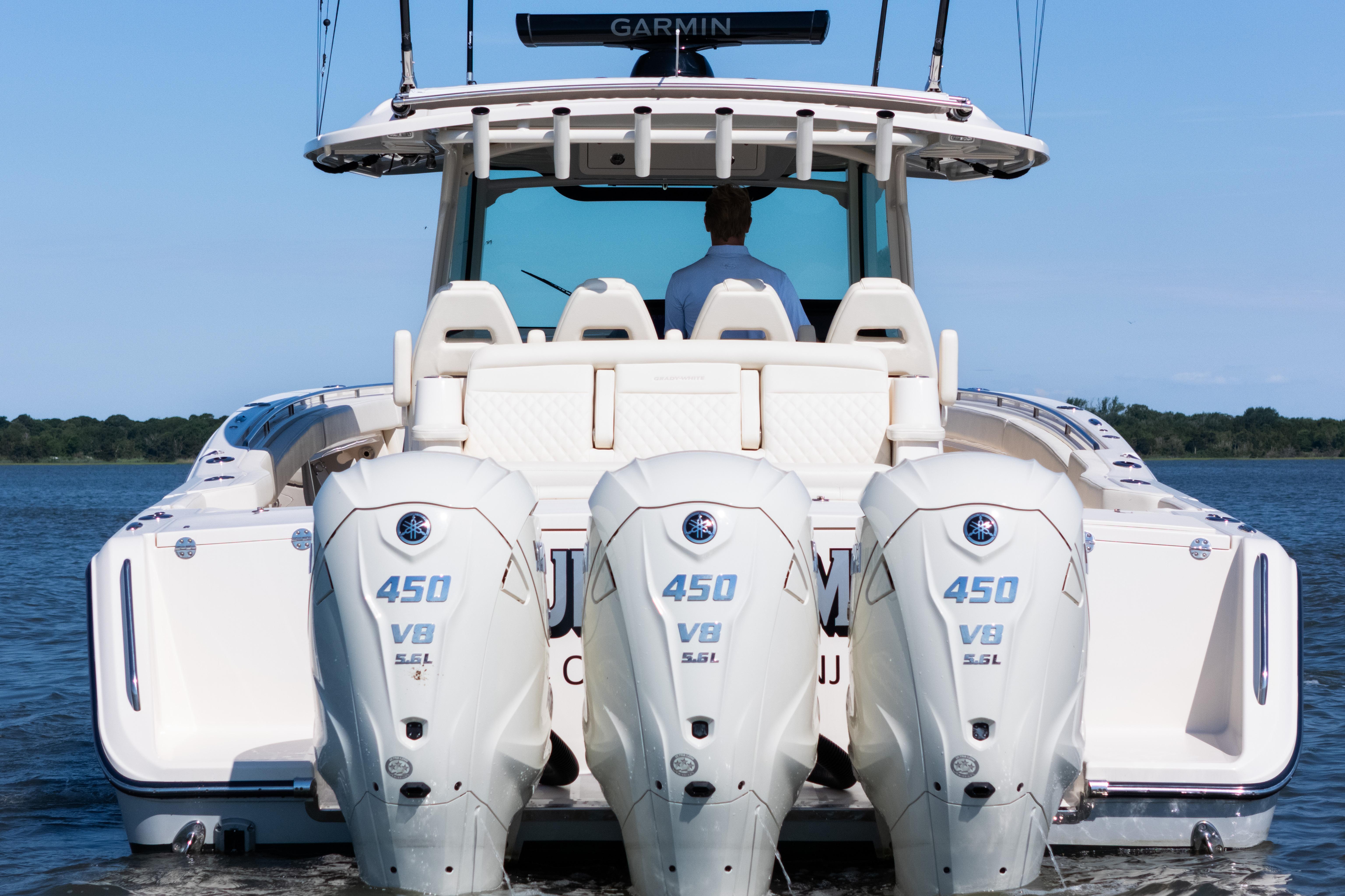 2025 Grady-White Canyon 386 boat with triple Yamaha 450 V8 engines on water.