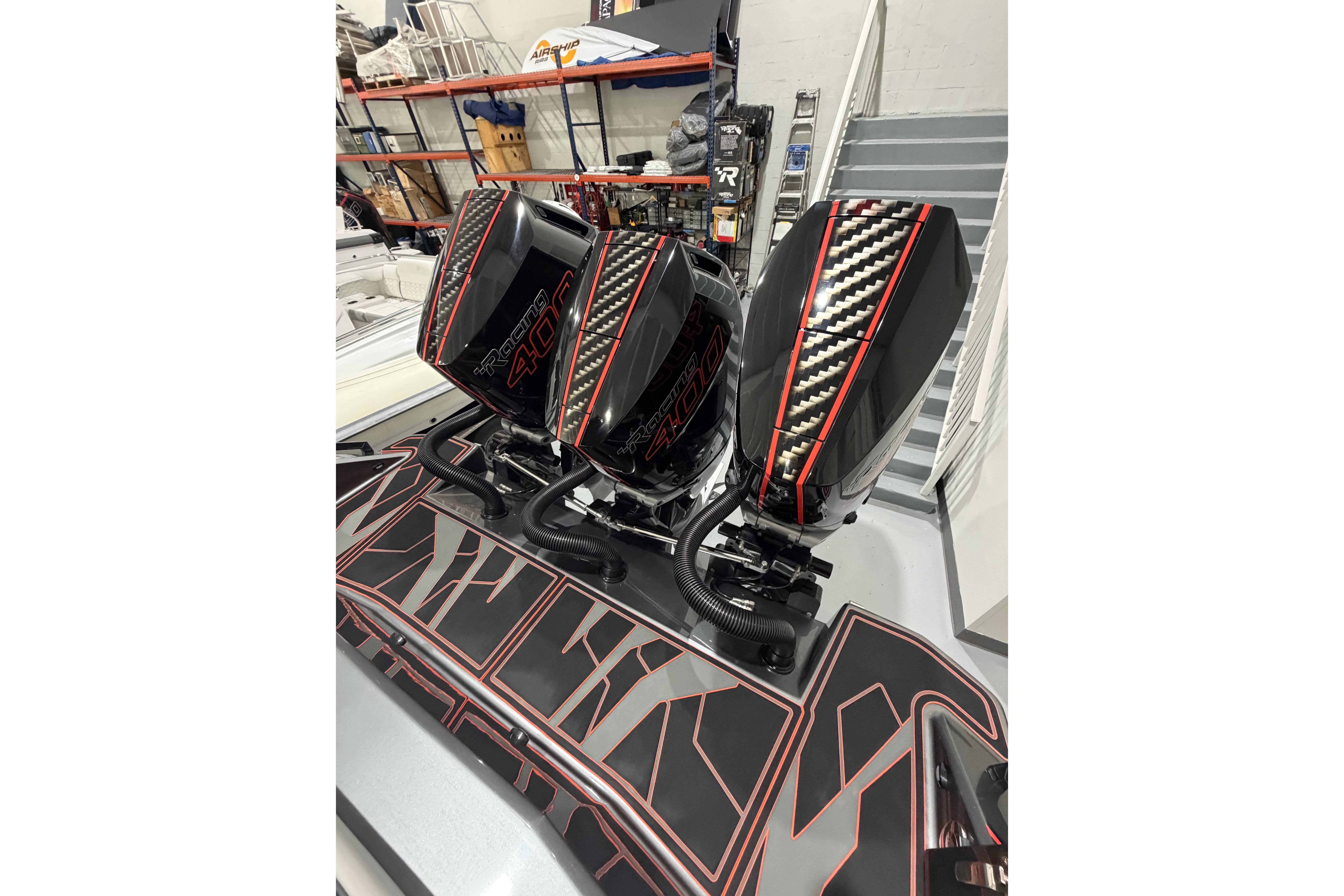Triple AMP 333 outboard motors with carbon fiber accents, 2026 model.