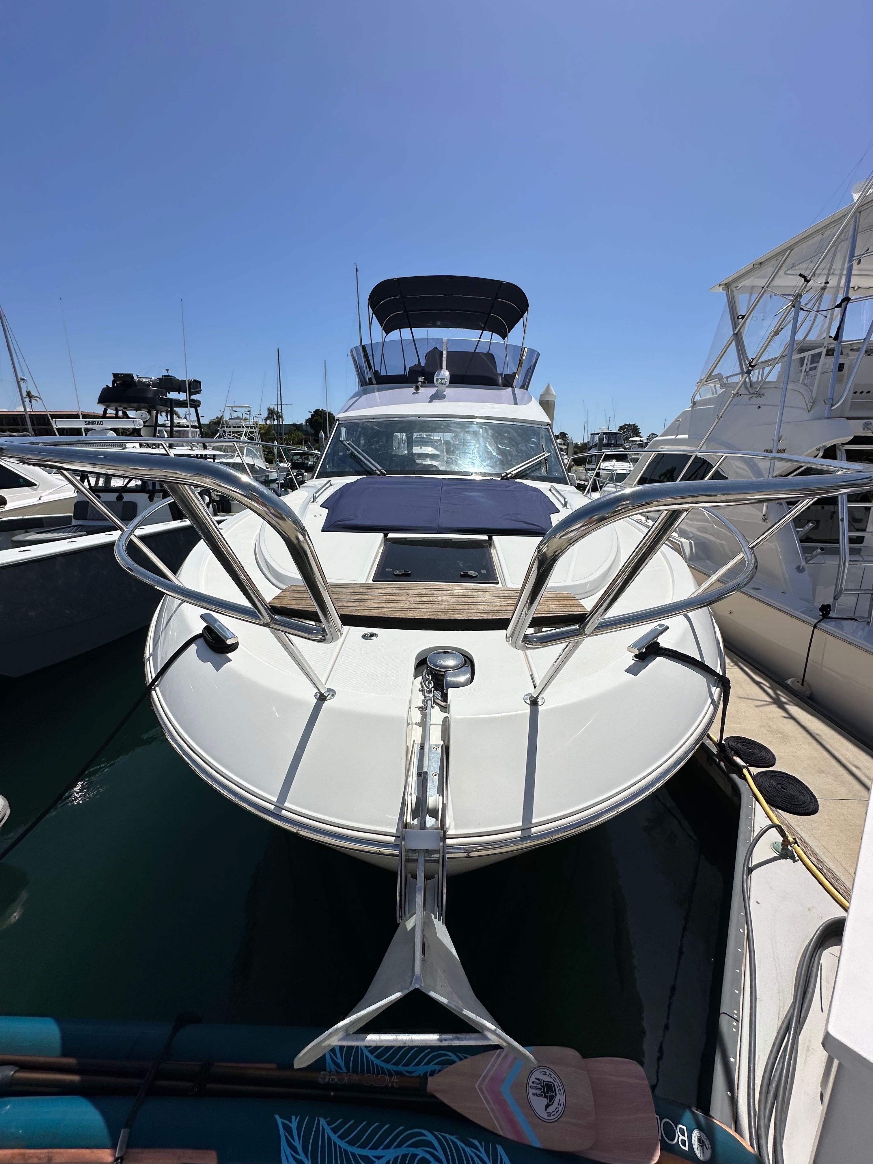 2024 Bavaria R40 yacht docked at marina under clear blue sky.