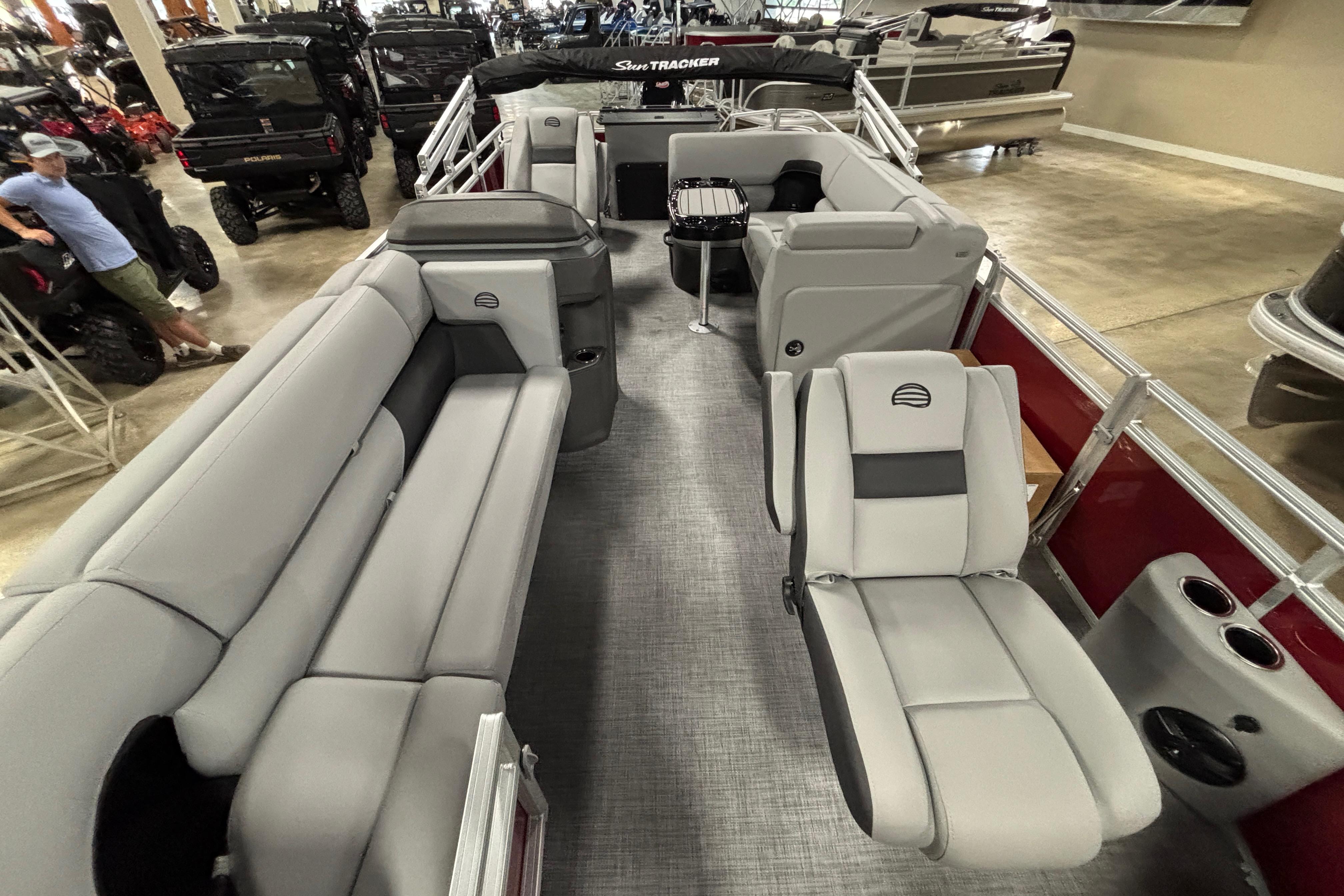 2026 Sun Tracker SportFish 20 DLX pontoon boat interior with gray seating and modern design.