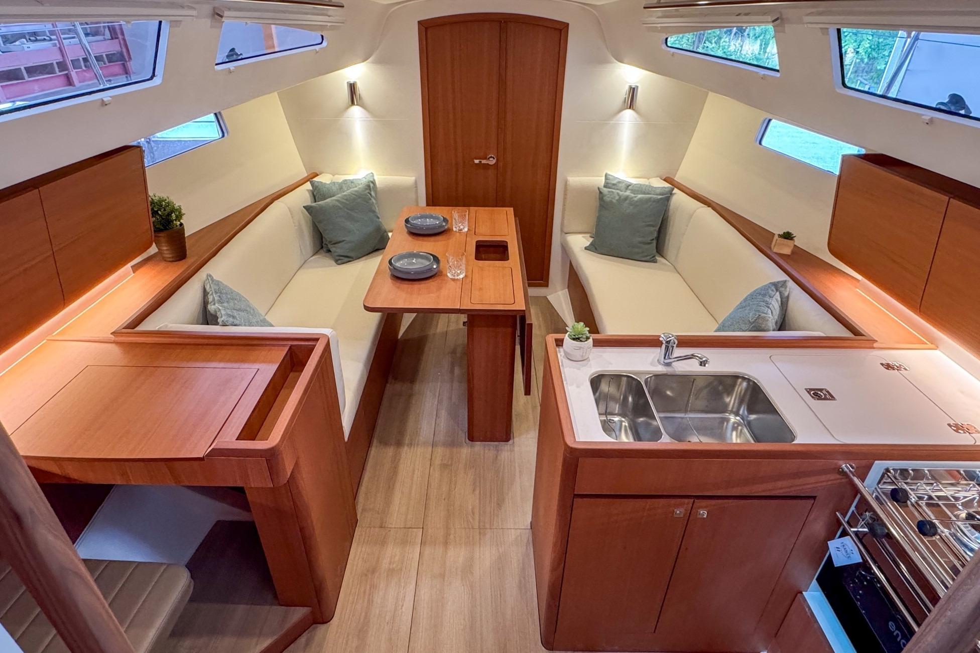 Luxurious interior of 2026 J Boats J/36 sailboat with modern kitchen and seating area.