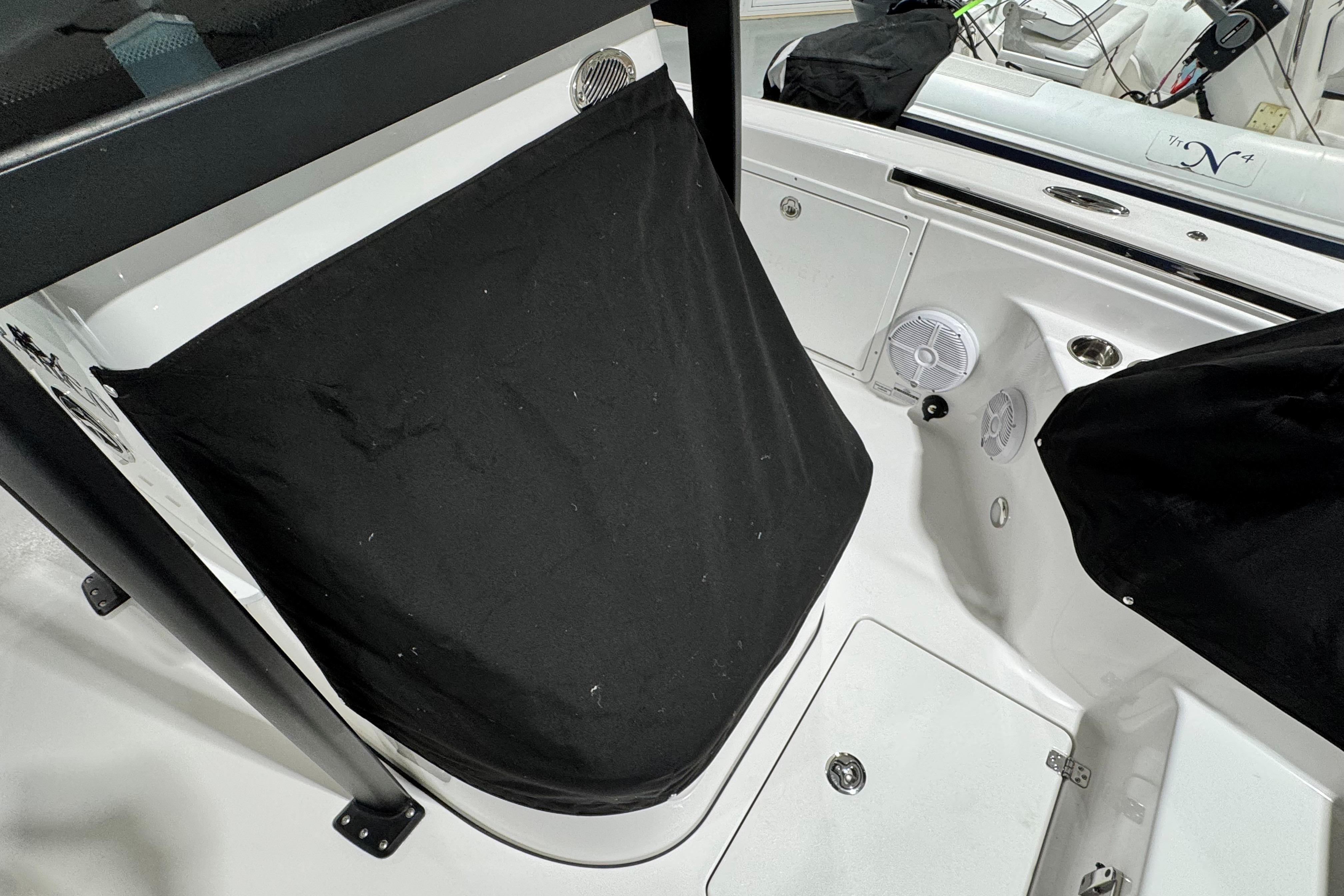 2025 Crevalle 24 HCO boat interior with black cover and speaker detail.