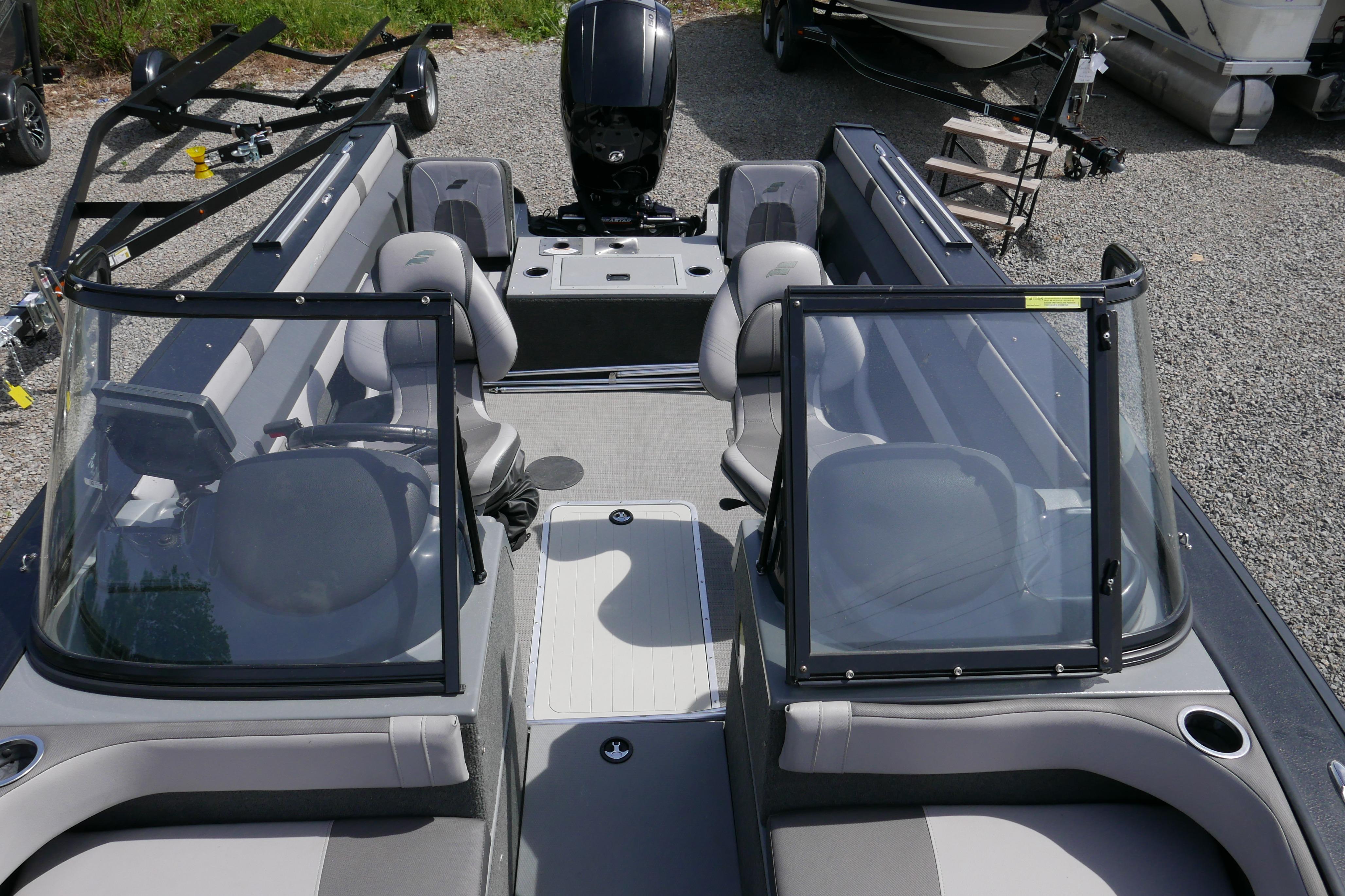 2016 Starcraft Titan 186 boat interior with seating and windshield.