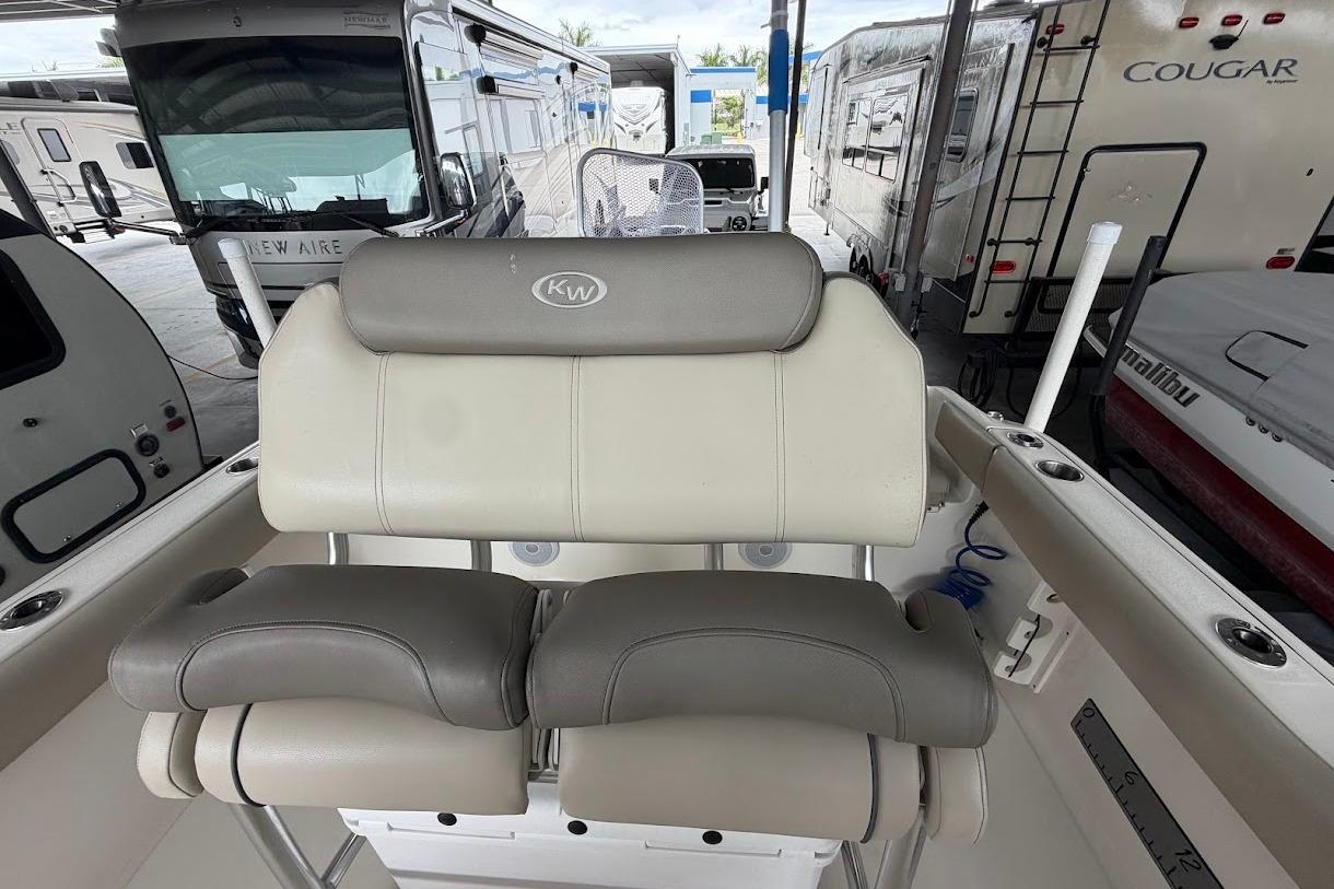 2024 Key West 219 FS boat seat with RVs in background at dealership.