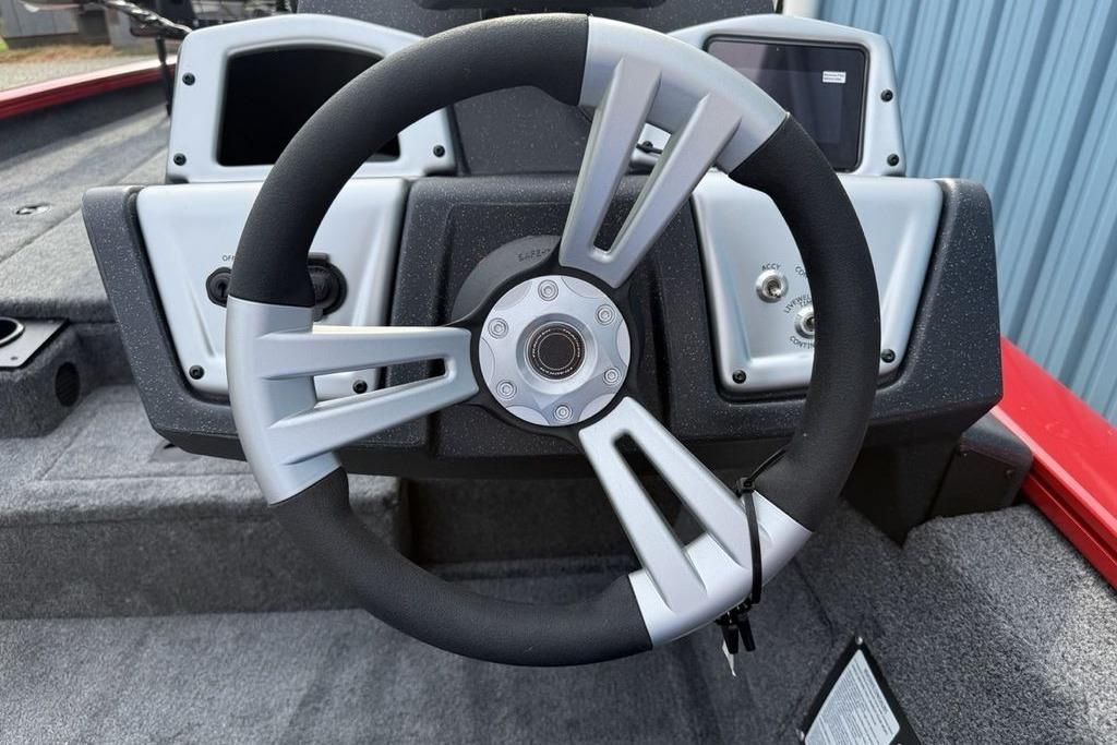 Steering wheel of 2026 Tracker Pro Team 175 boat, featuring modern dashboard controls.