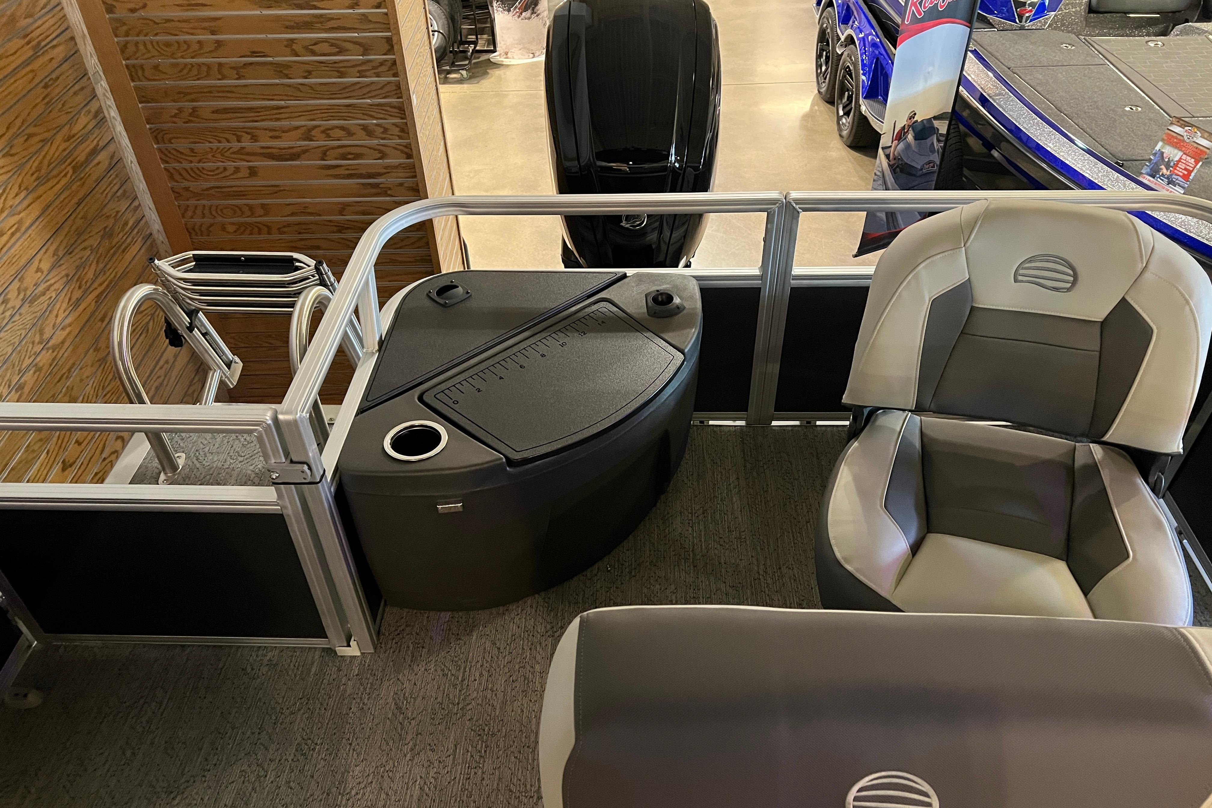 2026 Sun Tracker Bass Buggy 18 DLX interior with seating and storage features.
