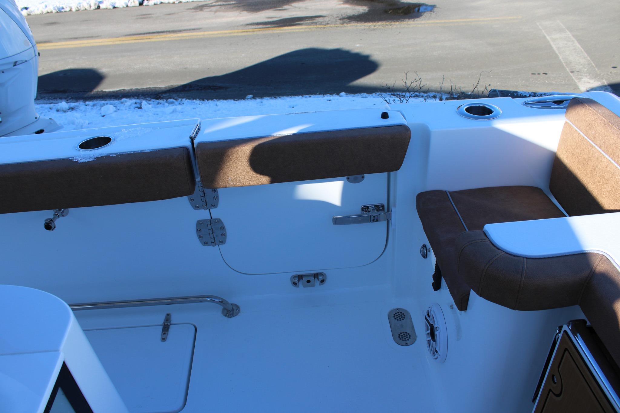 2026 Sea Hunt Gamefish 25 boat interior with cushioned seating and cup holders.