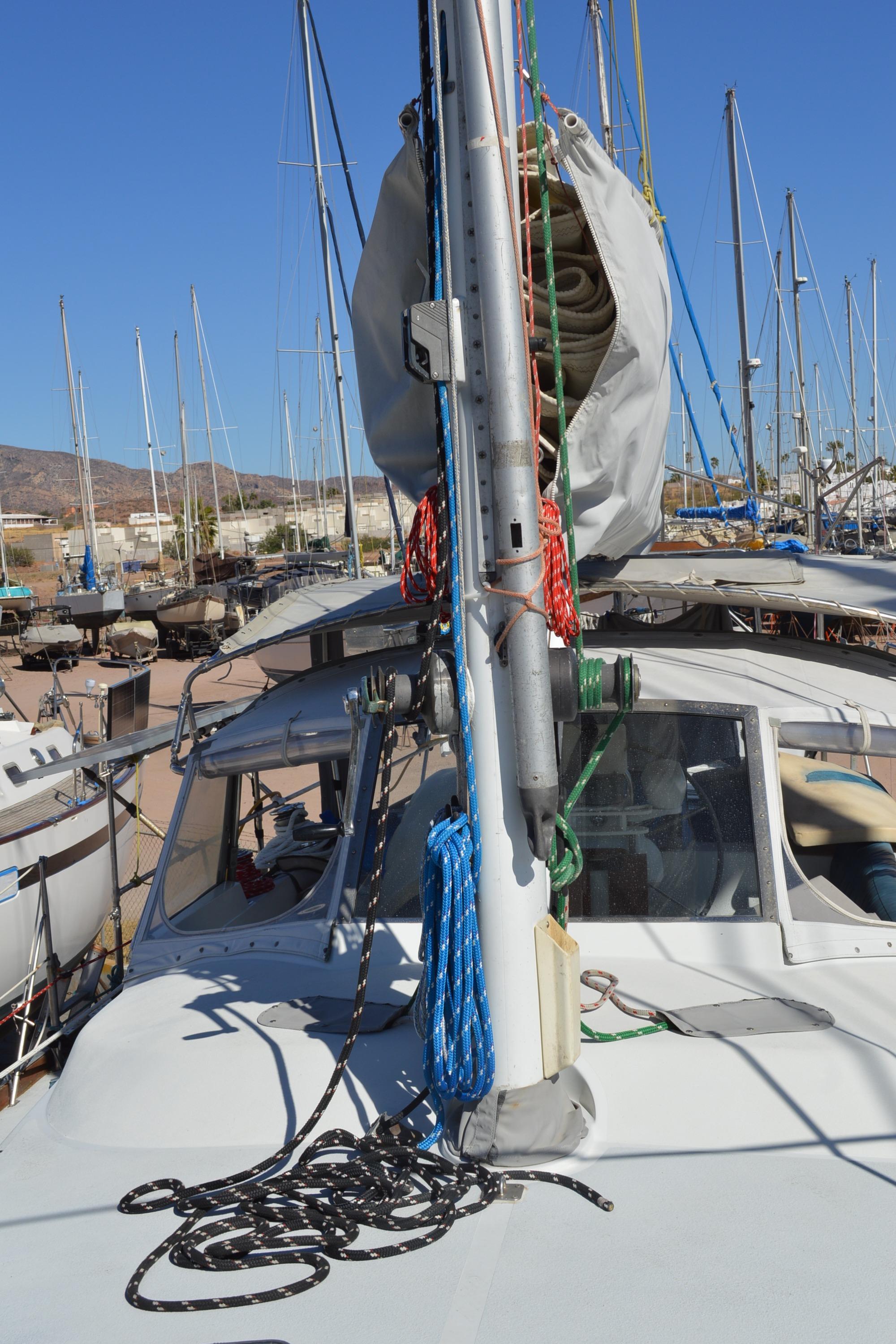1979 Morgan 461 sailboat deck with mast, ropes, and clear blue sky.