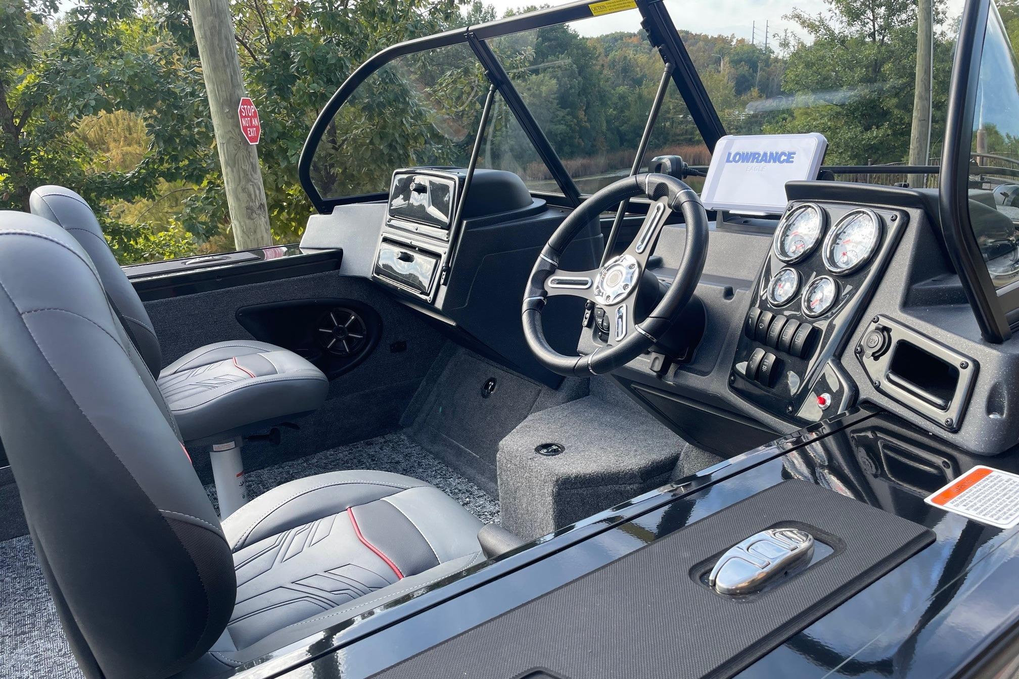2026 Tracker Targa V-18 WT boat interior with steering wheel and dashboard controls.