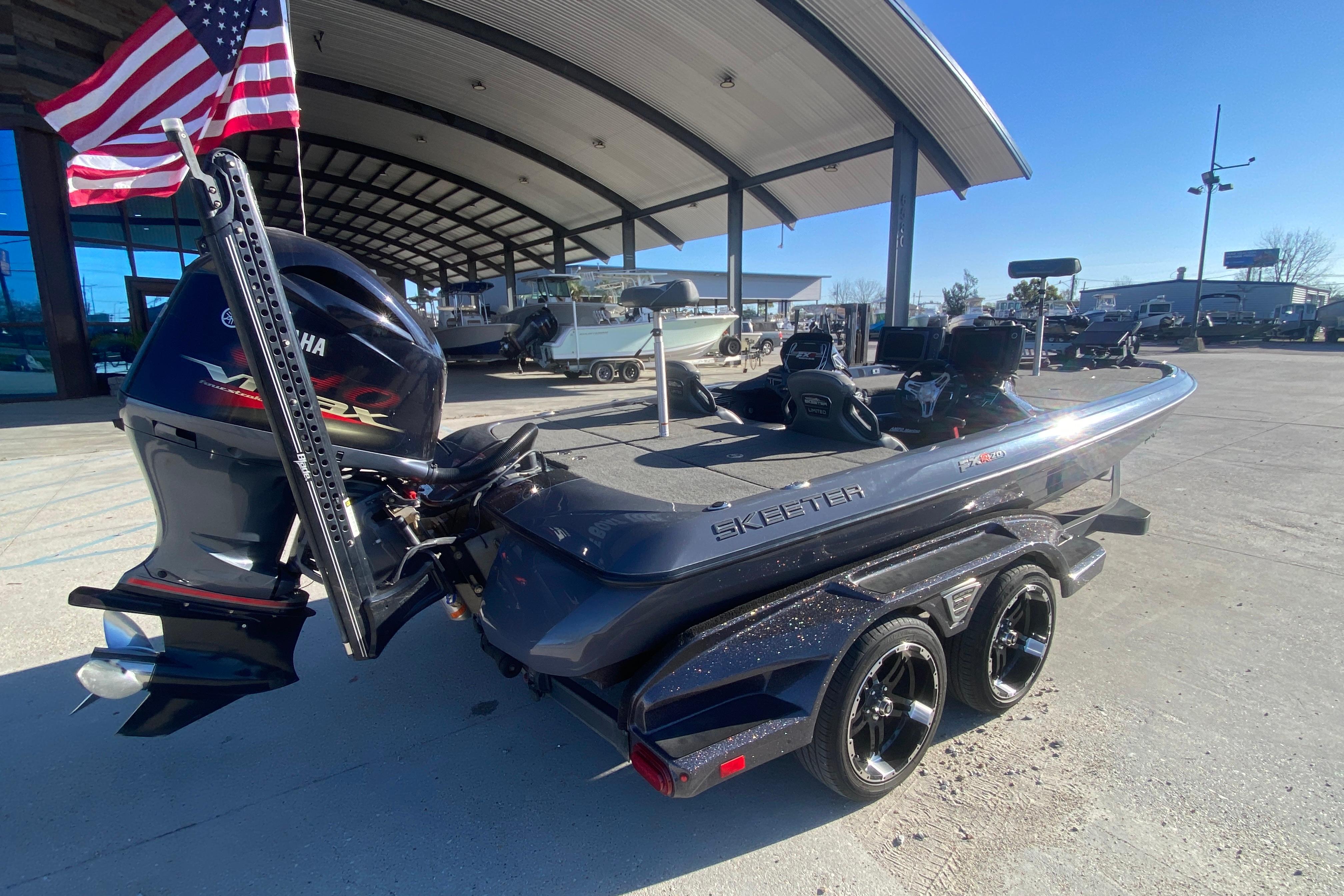 2020 Skeeter FXR20 Limited boat with Yamaha engine, parked outdoors under a canopy.