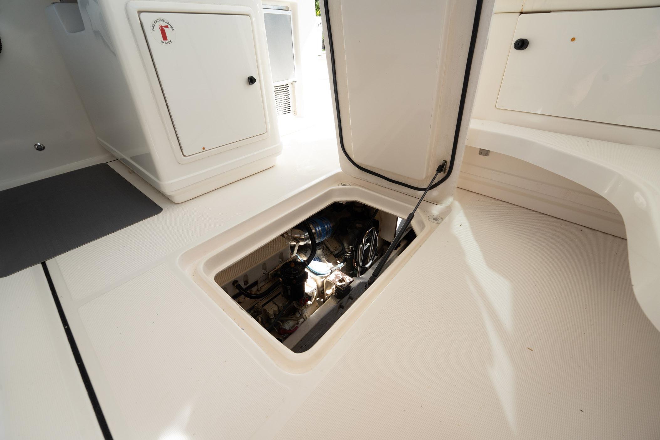 Engine compartment of a 2002 Tiara Yachts 4100 Open, showcasing interior access.