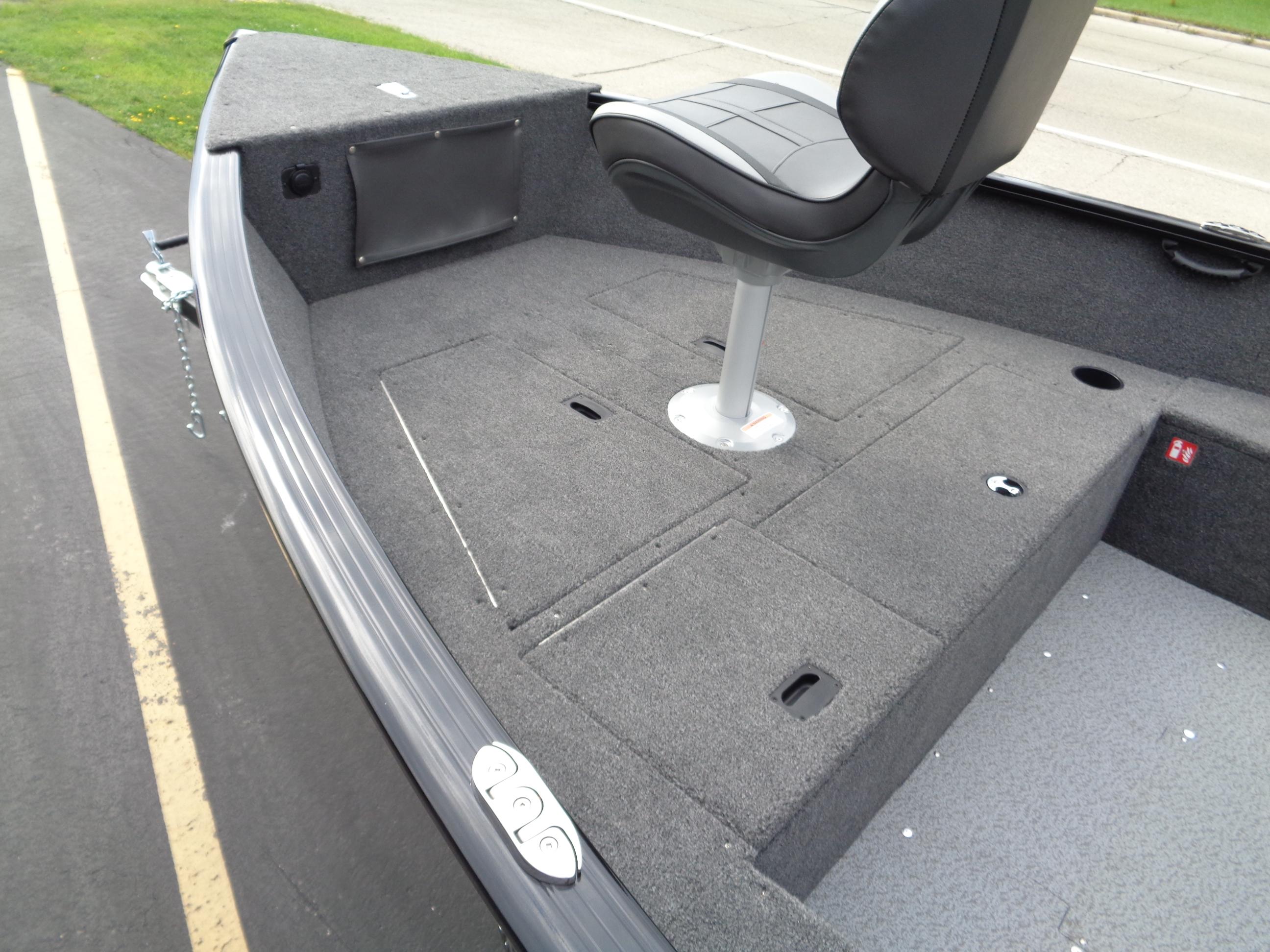 2025 Lund 1650 Rebel XL Tiller boat interior with seating and storage compartments.