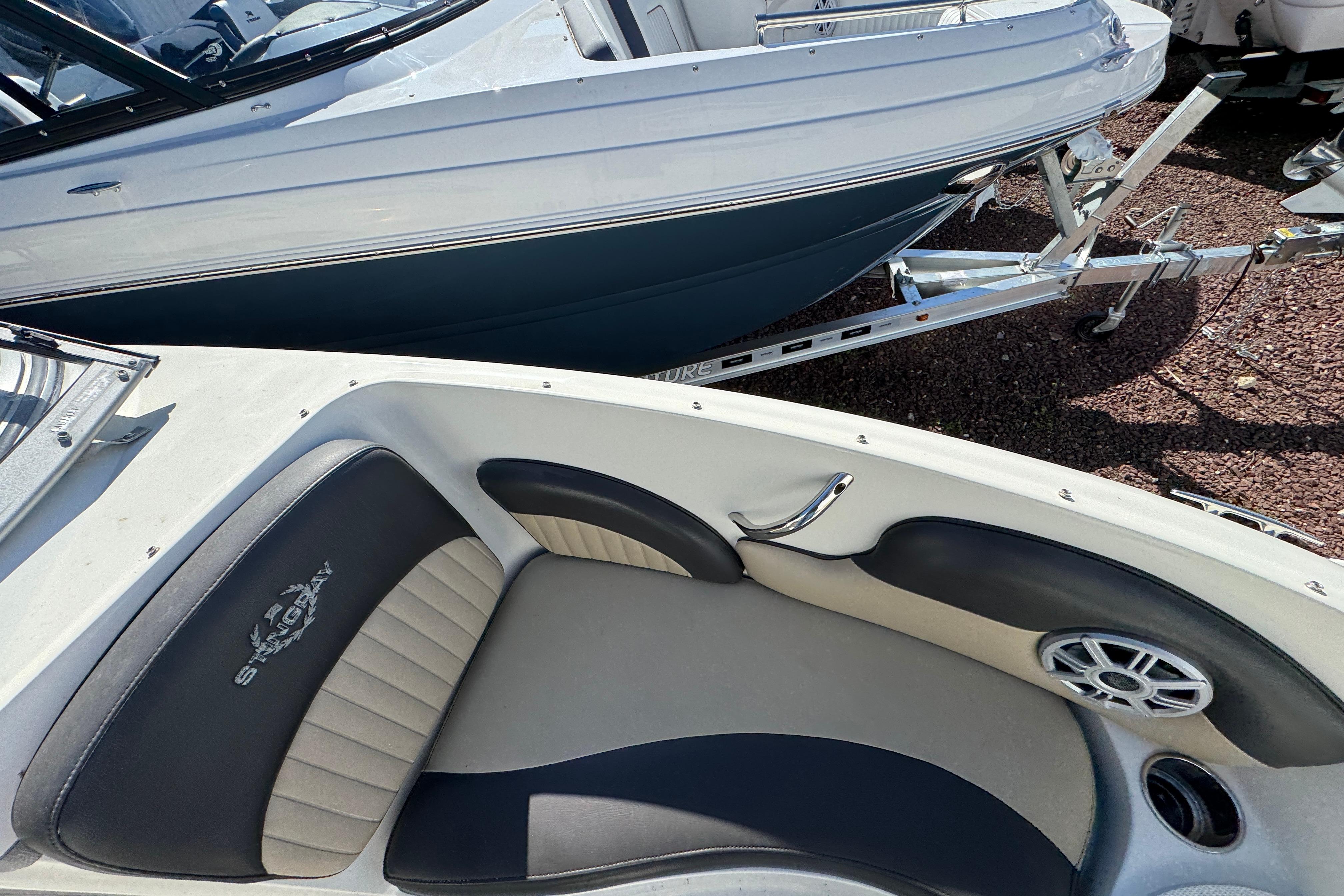 2018 Stingray 204 LR boat interior with seating and speaker detail.