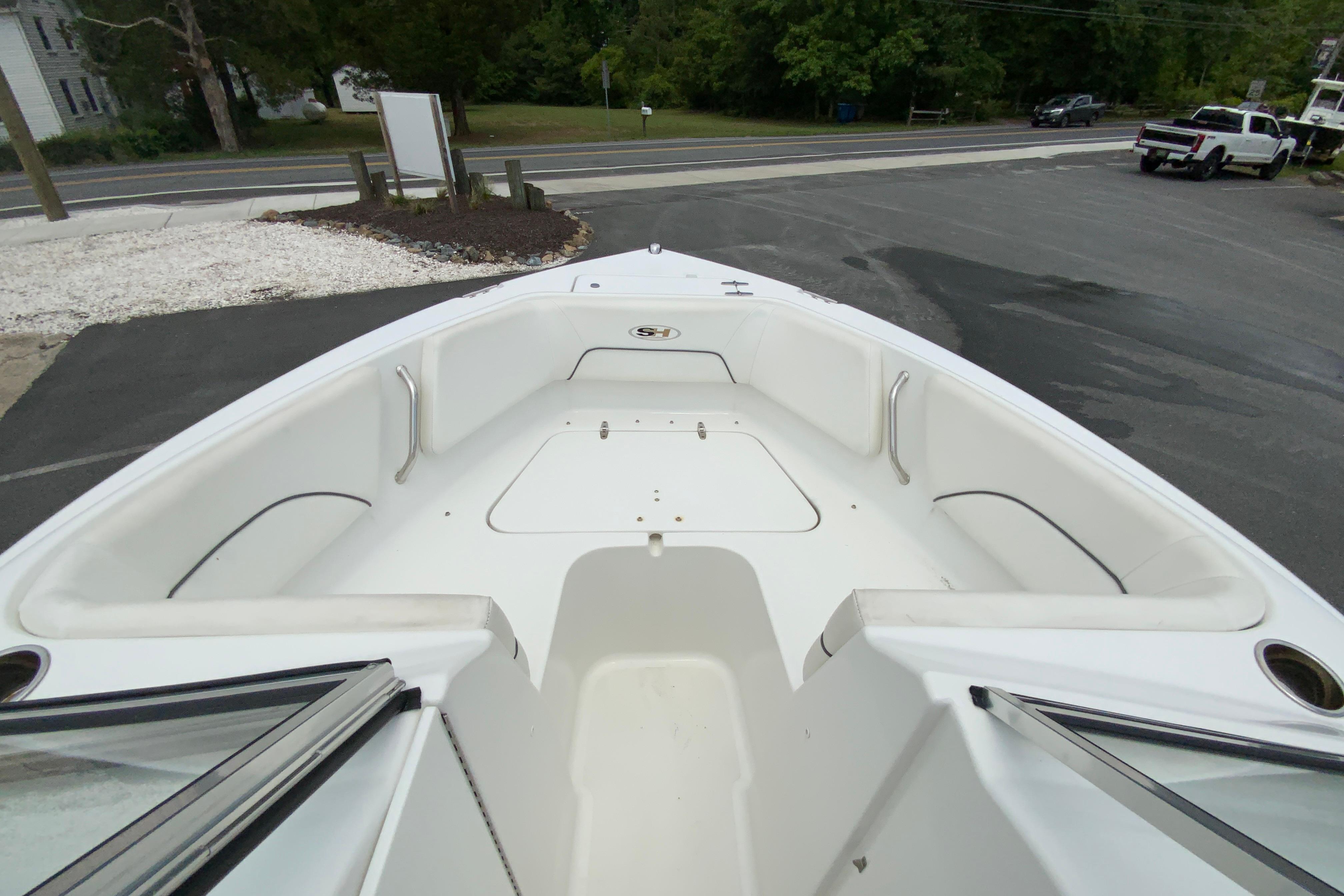 2014 Sea Hunt Escape 211 LE boat interior with spacious seating and storage compartments.